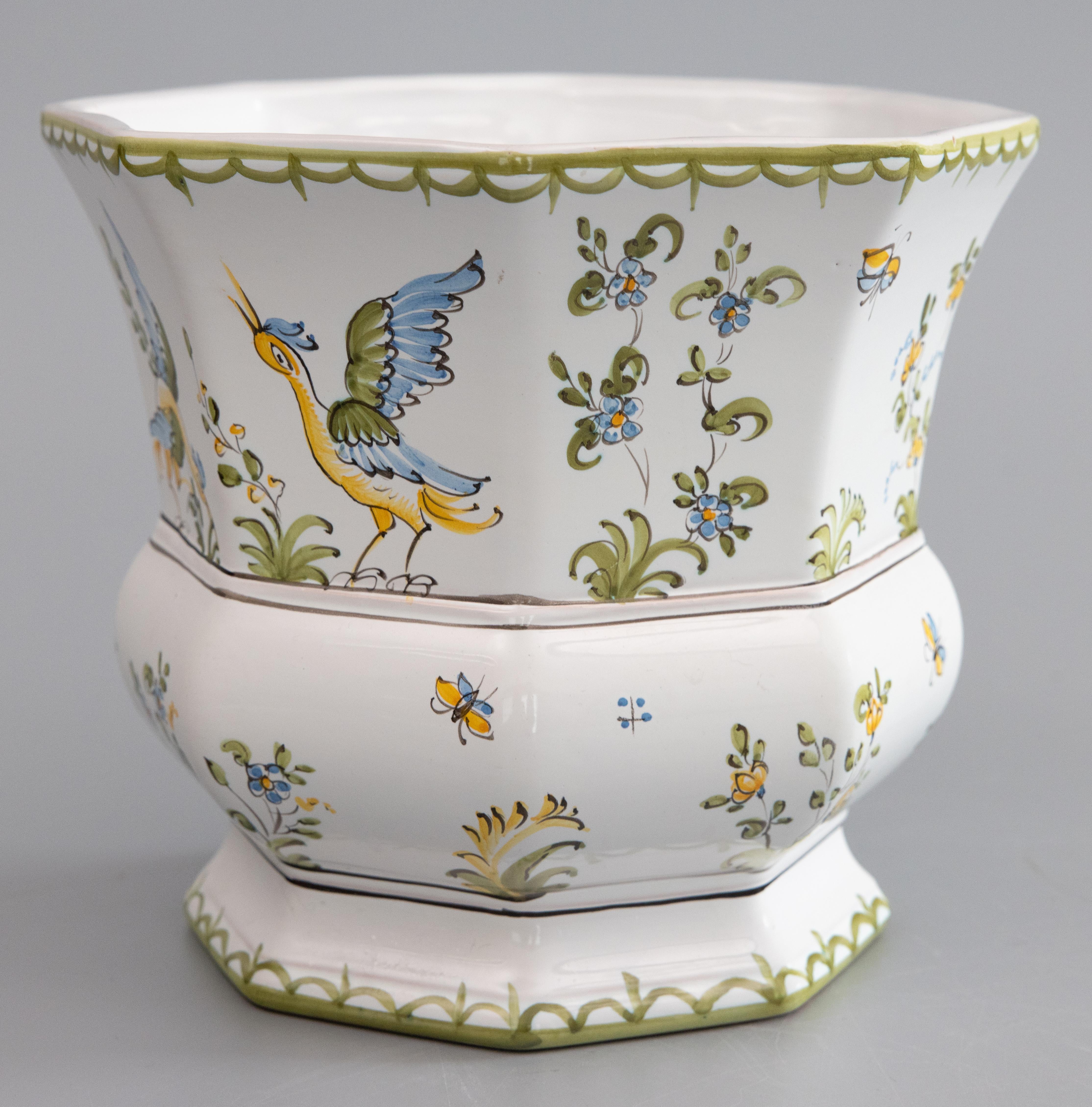 A lovely vintage faience jardiniere / planter / cache pot from Lallier-Moustiers in France. This beautiful planter has an octagonal shape with elegant hand painted birds, insects, and flowers. Maker's mark on reverse. It would be perfect with your