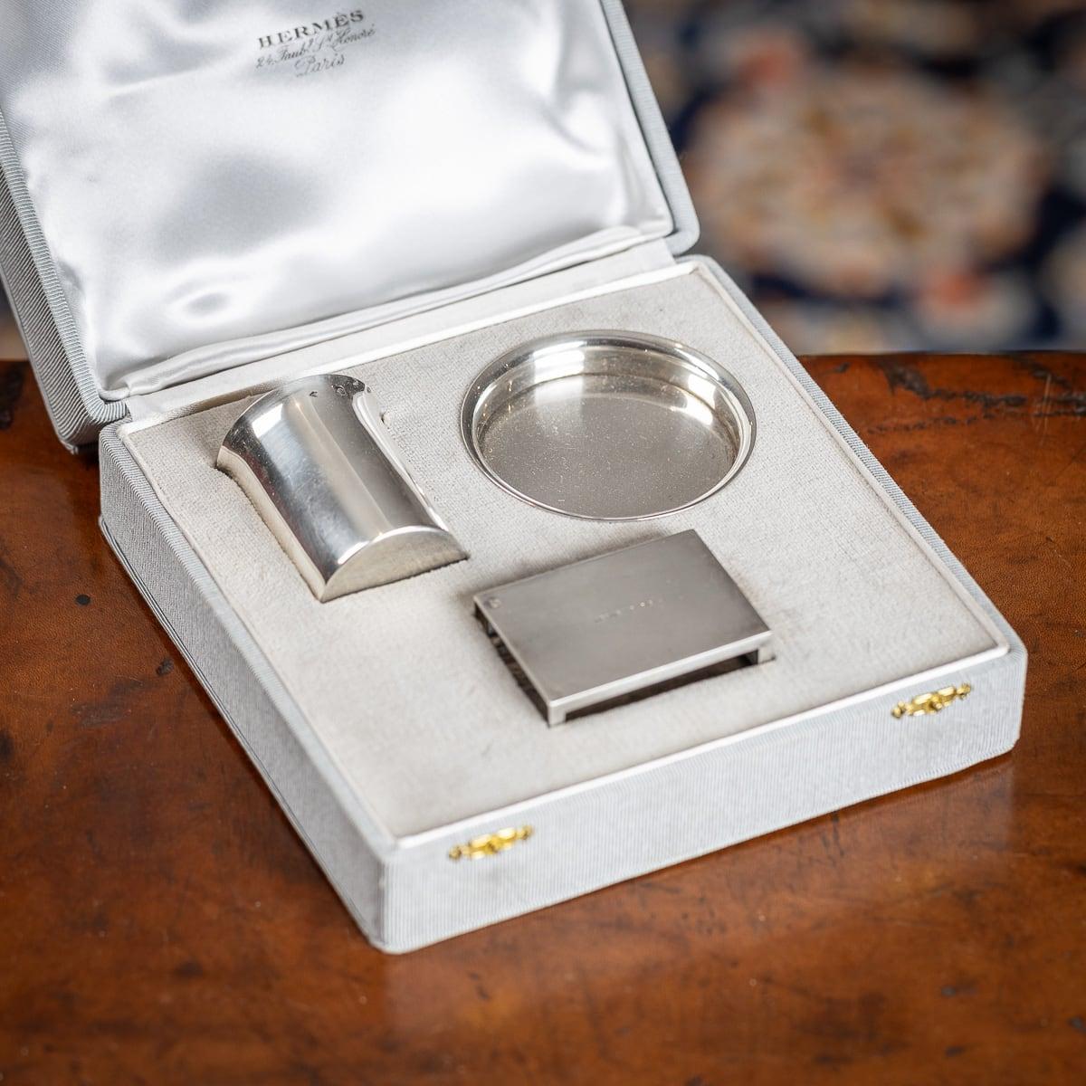 Stylish mid 20th Century French Art Deco Hermes 3 piece vermeil solid silver smoker's requisites, contained in the original Hermes fitted grosgrain case, comprising four cigarette canisters ashtray and a match holder. The case is stamped 