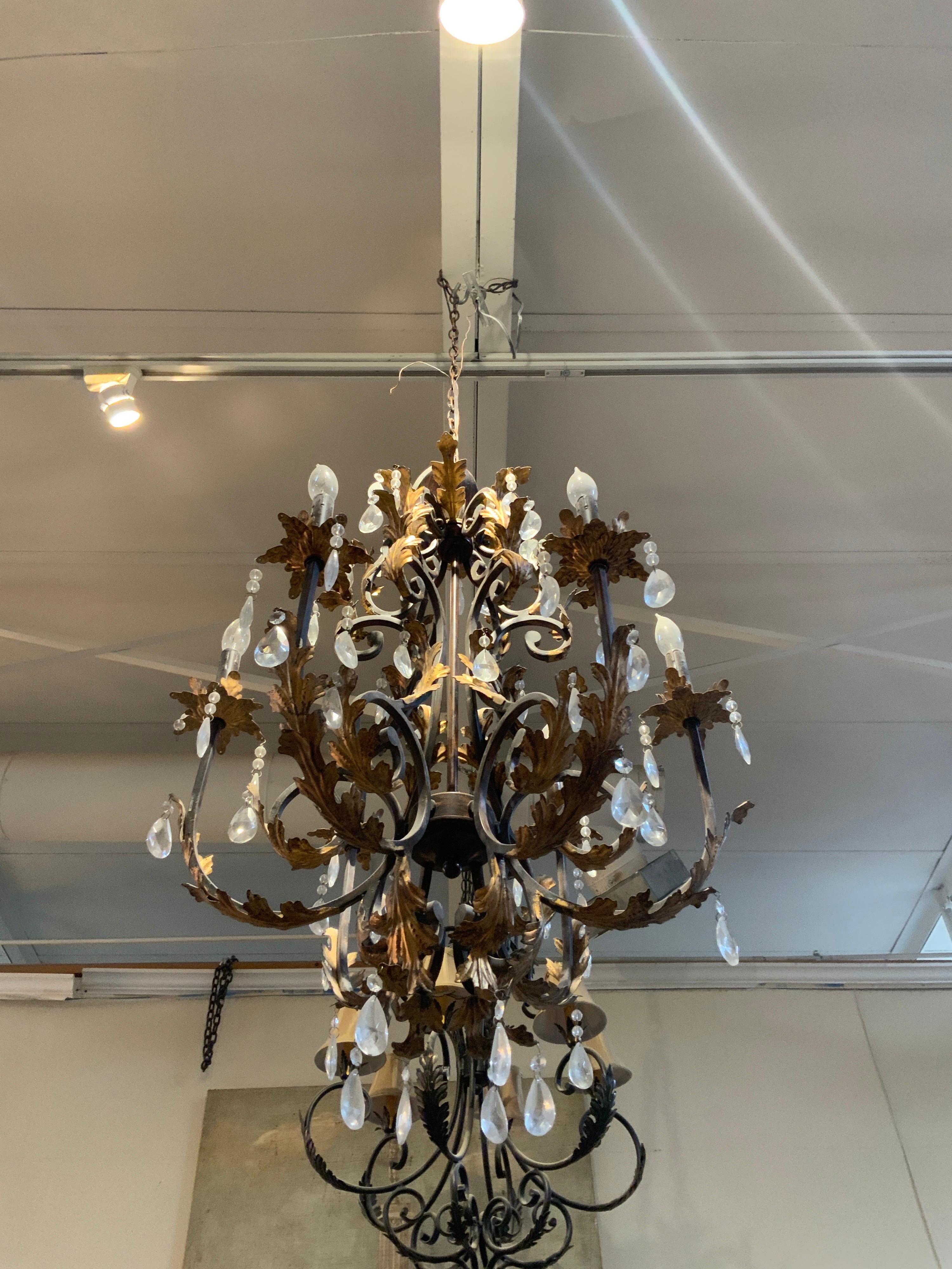 This iron chandelier originates from France, circa 1950.