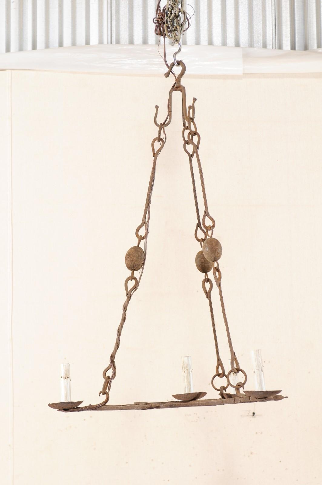 Patinated Mid-20th Century French Iron Triangular Chandelier For Sale