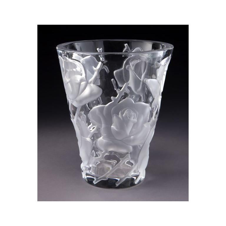 Fill this elegant, mid-20th century crystal vase with fresh flowers. Crafted in France circa 1950 by Marc Lalique, the round Ispahan rose vase features an etched and frosted floral, branch and thorn motifs in high relief. Ispahan refers both to a