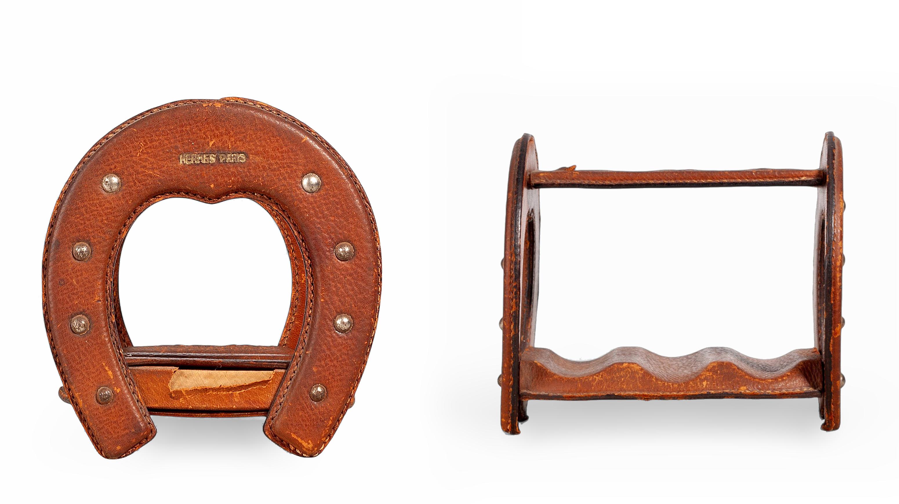 Mid-20th century Modern French leather horseshoe-shaped cigar holder by Hèrmes Paris

By: Hermès Paris
Material: leather
Technique: embossed, polished
Dimensions: 6 in x 5 in x 5.5 in
Date: mid-20th century
Style: Mid-Century Modern, Space Age
Place