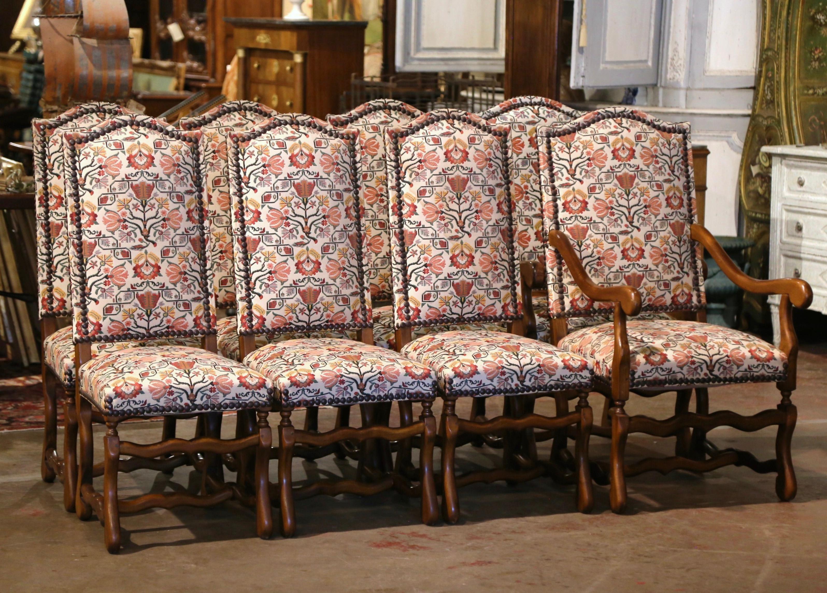 This elegant suite of six side chairs and matching armchairs were crafted in France, circa 1950. Each chair stands on carved 