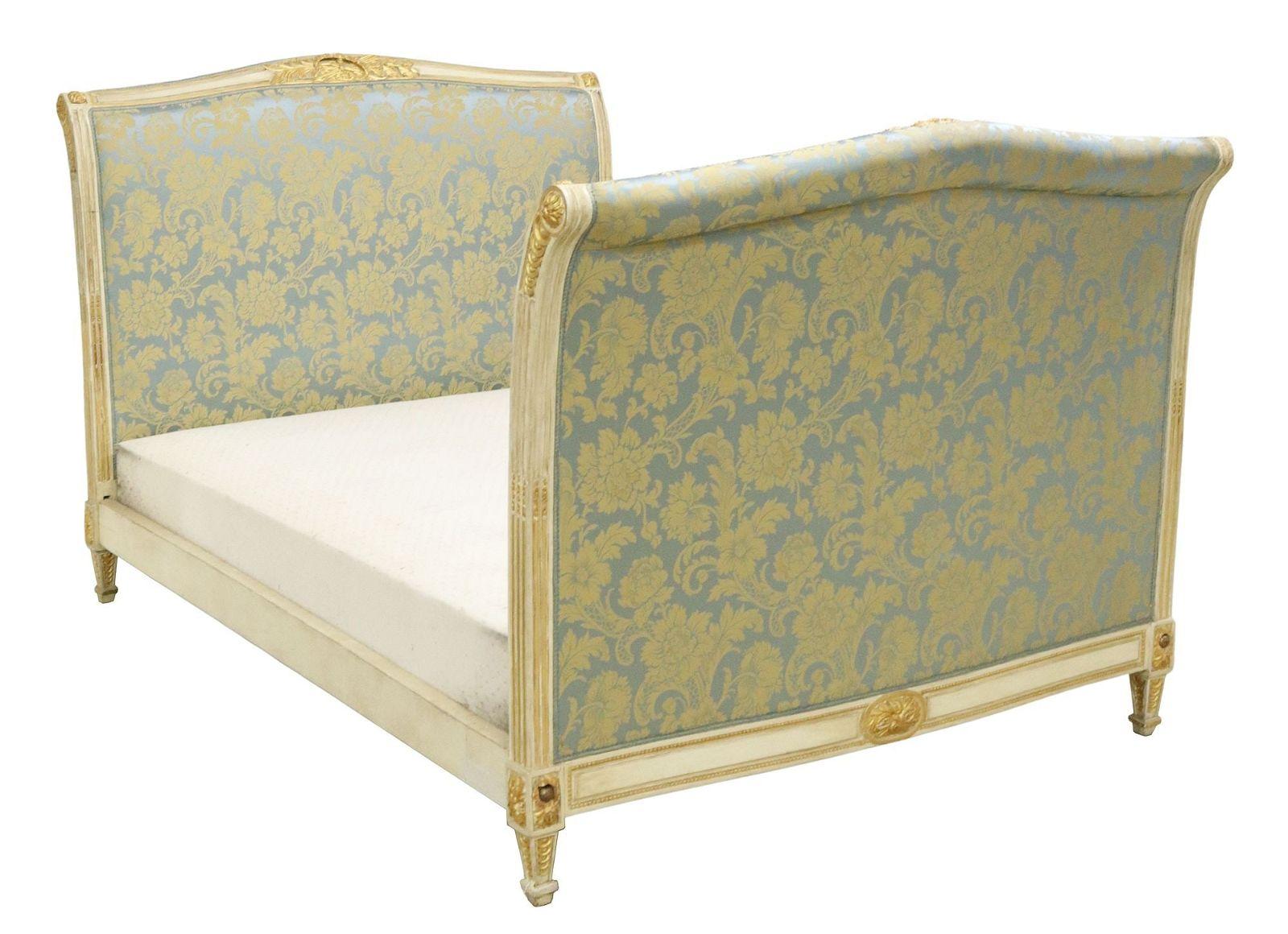 French Louis XVI style alcove bed, 20th c., having white and gilt painted wood frame, in later floral-patterned upholstery, with ribbon trim, rising on squared and tapered supports, loss to upholstery at right side rail.
Mattress not