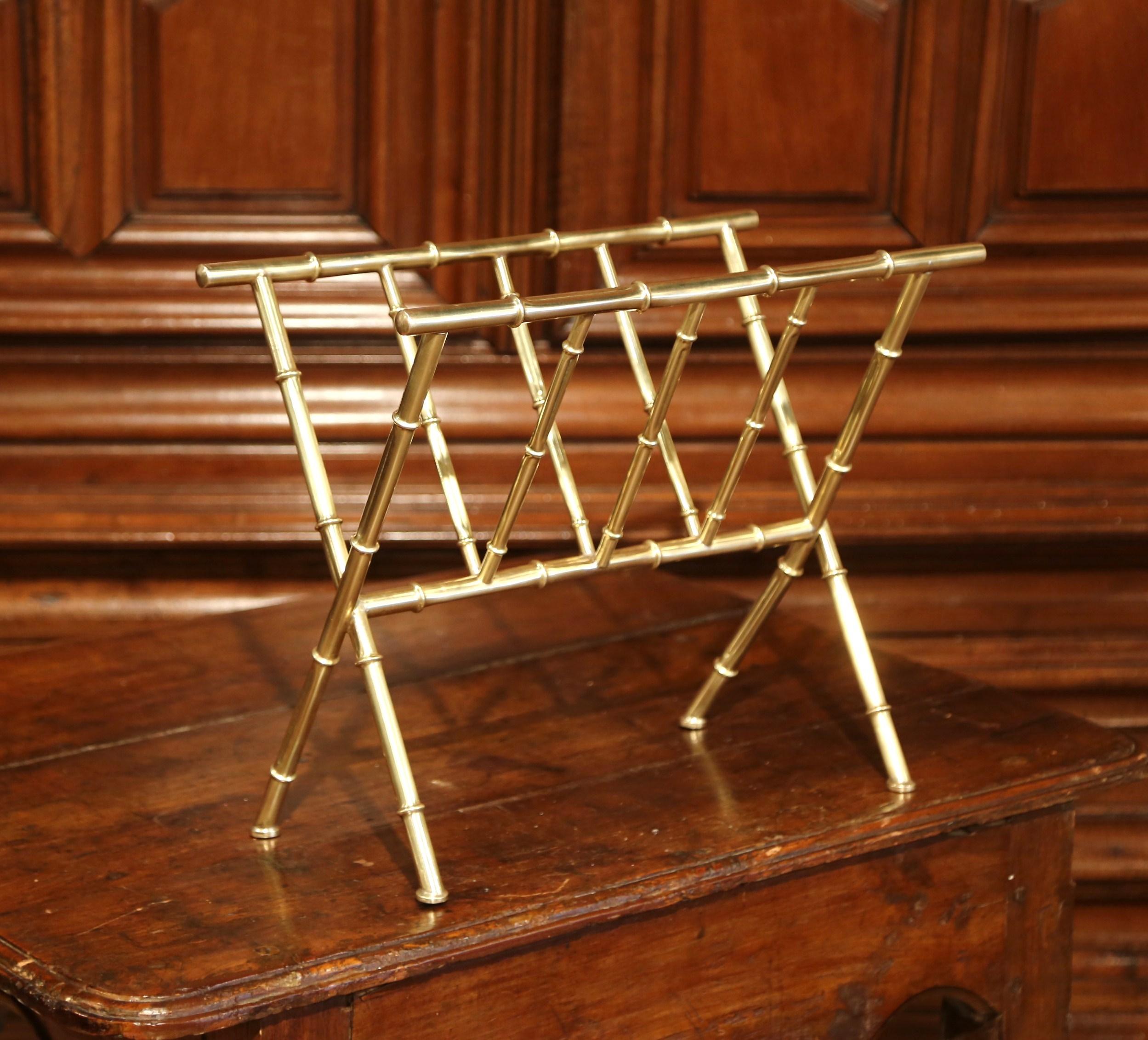 Keep your newspapers organized and neat inside this vintage Baguès magazine holder. Crafted in France circa 1950, the elegant, midcentury brass stand is both useful and stylish. The rack has a popular faux bamboo design with wonderful, clean lines