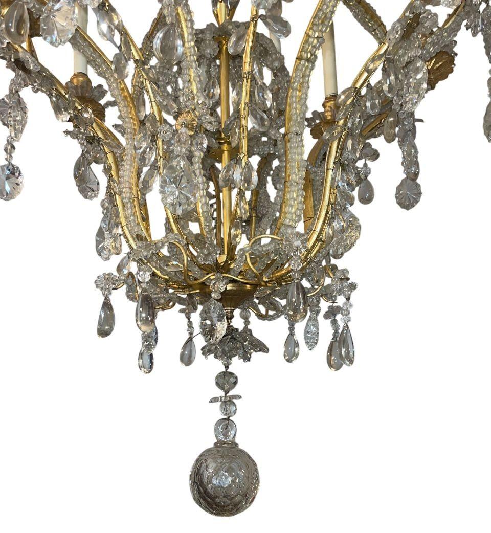Francese Lampadario in cristallo e ferro dorato della Maison Baguès della metà del XX secolo in vendita