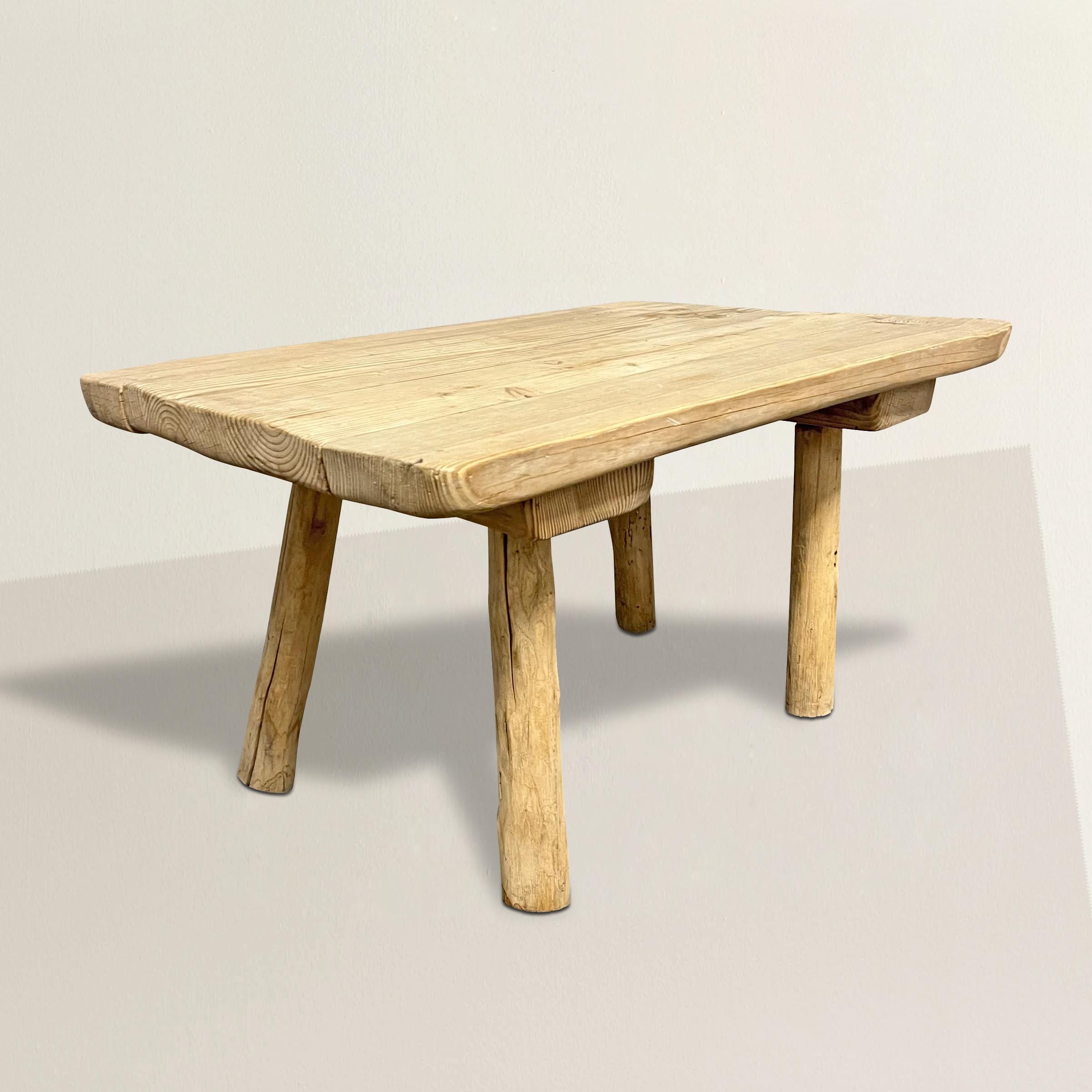 This exquisite 1950s French modernist pine low table, executed in the true Modernist spirit, embodies the essence of timeless elegance and functionality. Characterized by clean lines, minimalist form, and a harmonious blend of function and