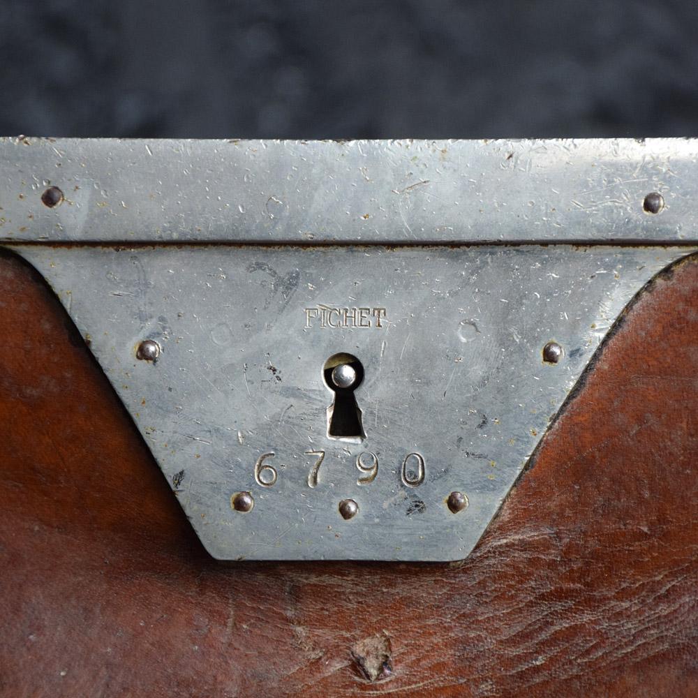 We are proud to offer a rare example of a mid-20th Century French money couriers leather and brass carrying bag. Made from a high quality dark tan leather, brass text riveted (Courier 15) and stamped example on both sides of the bag. This artifact