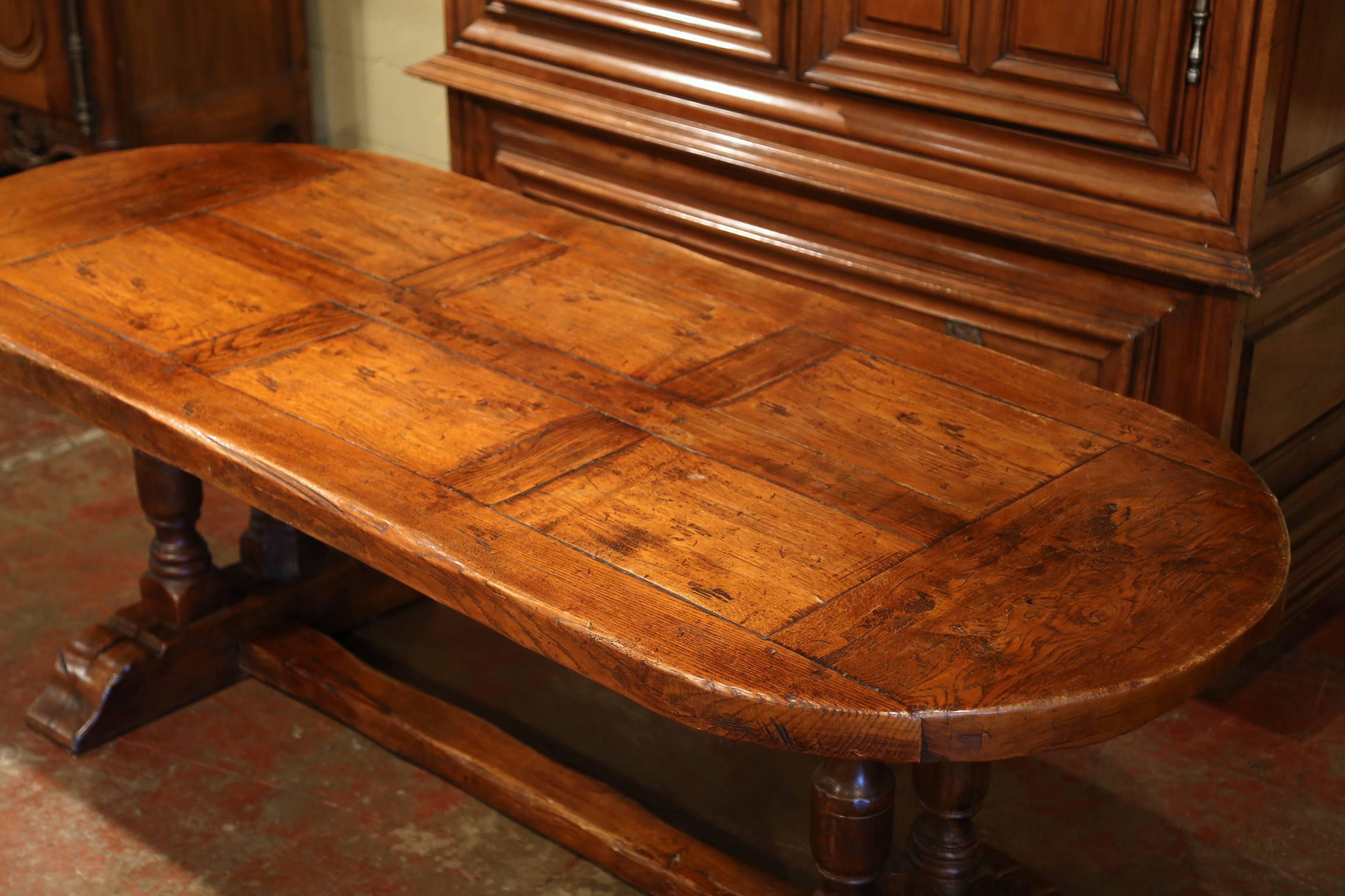 Louis XIII Mid-20th Century French Oval Chestnut and Oak Rustic Trestle Farm Table