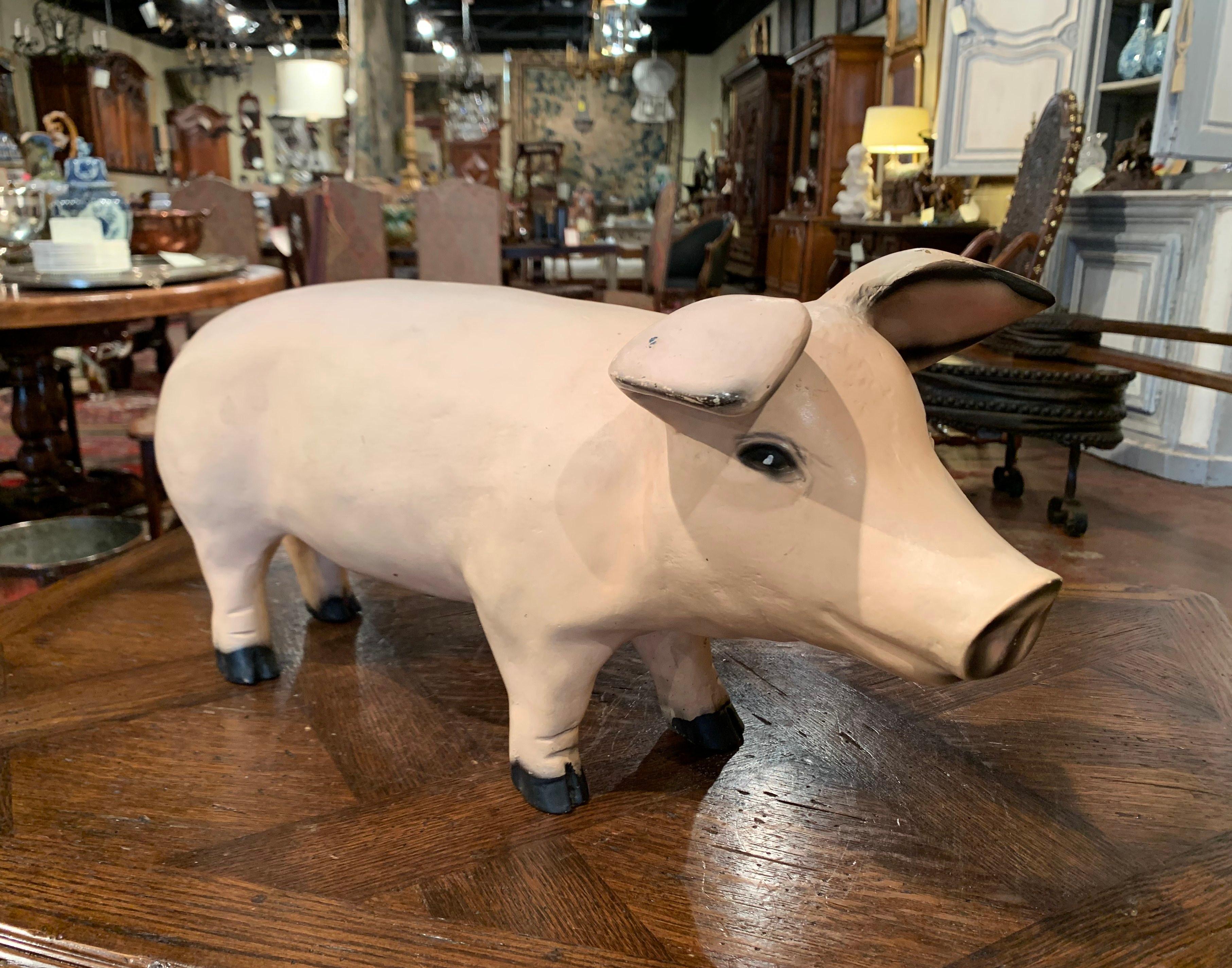 Decorate a kitchen counter or a shelf with this large vintage pig sculpture. Crafted in France circa 1960, the standing pig with cute facial and ear features, adorns a rich painted patinated finish in the pink palette embellished with black painted