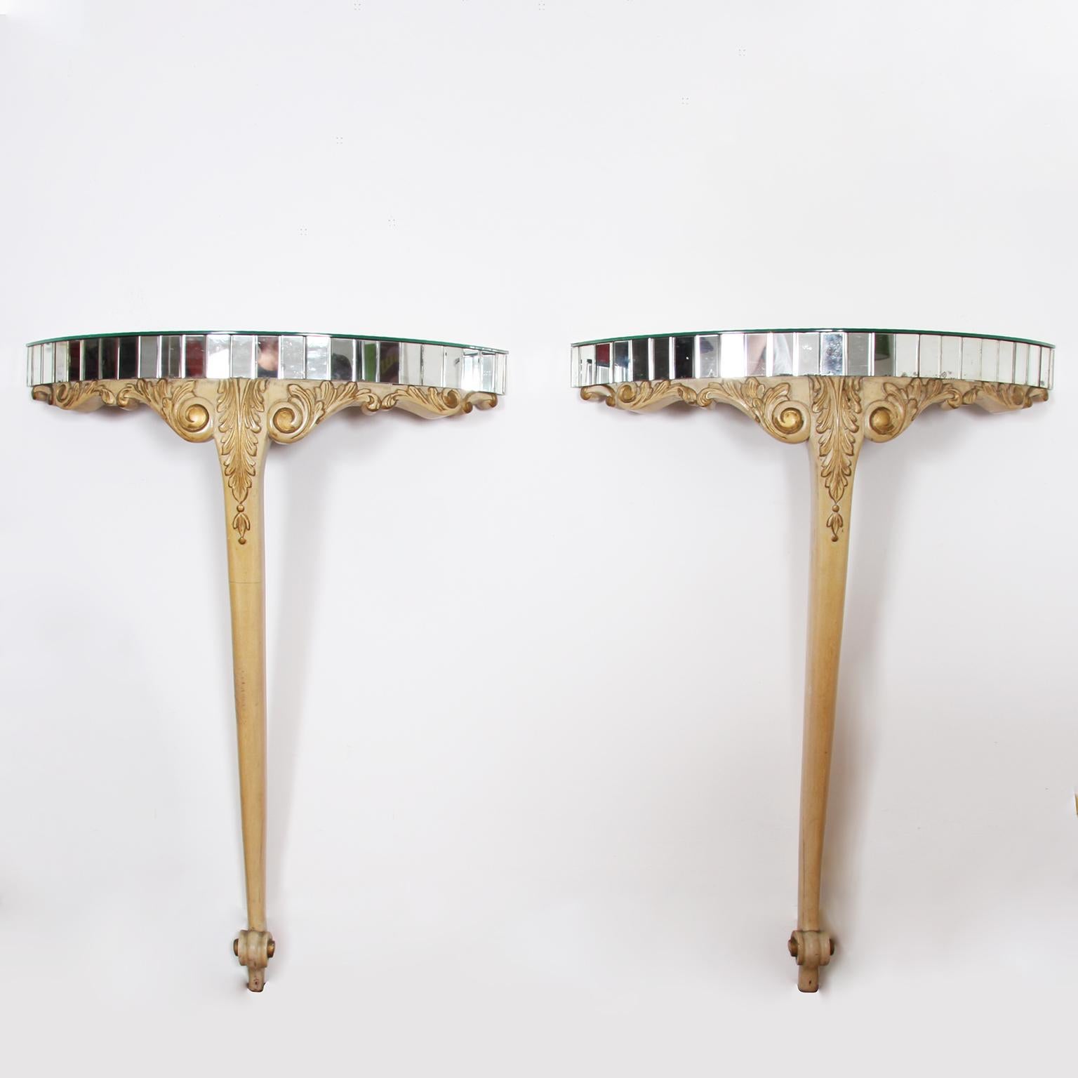 French, mid-20th century

A pair of giltwood console tables. Painted with mirrored tops.