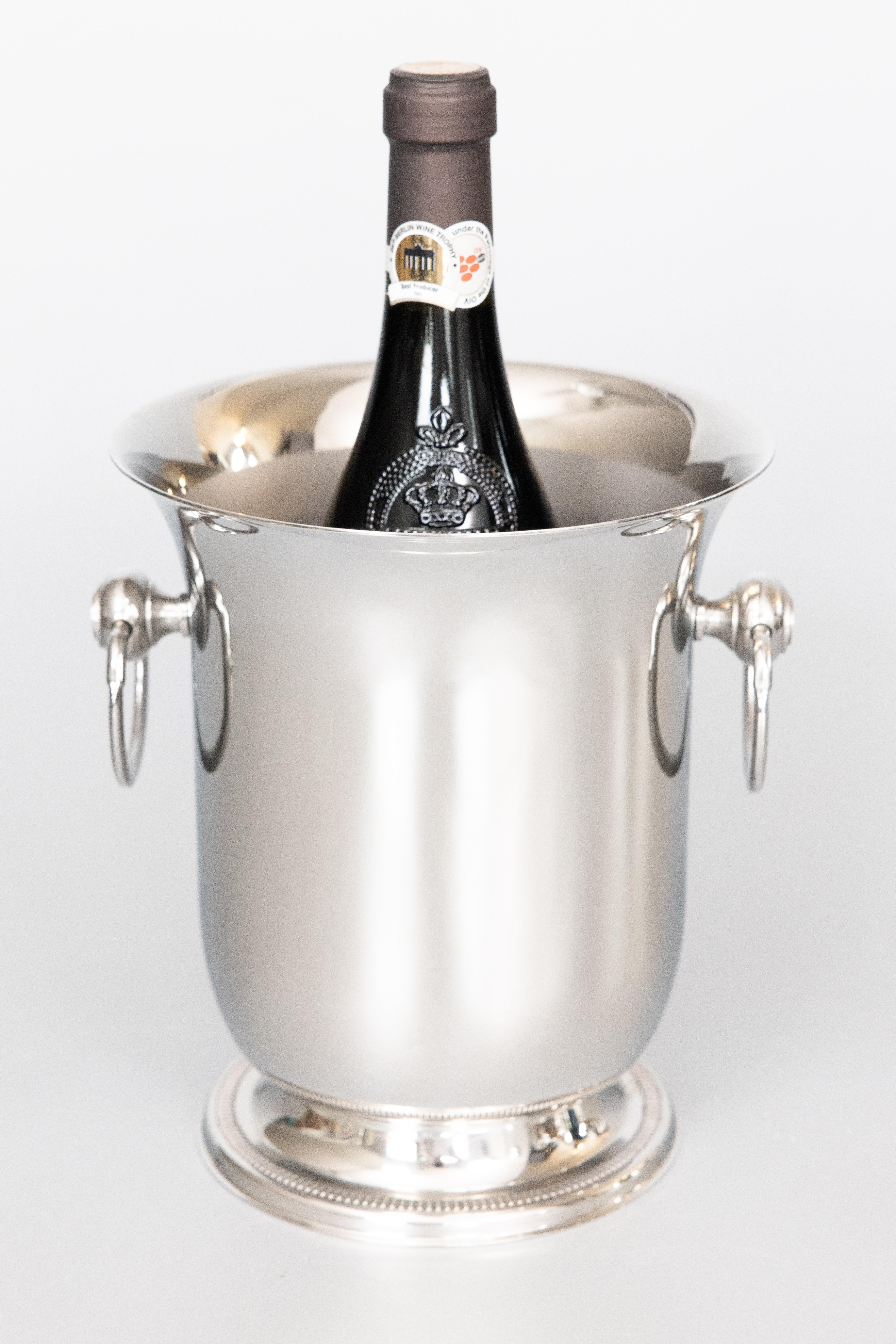 A fabulous Mid-20th Century French Art Deco style chrome plated champagne bucket or wine cooler by Jean Couzon made in France. Maker's mark on reverse. This stylish ice bucket is well made and heavy with a sleek design and ring handles, perfect for