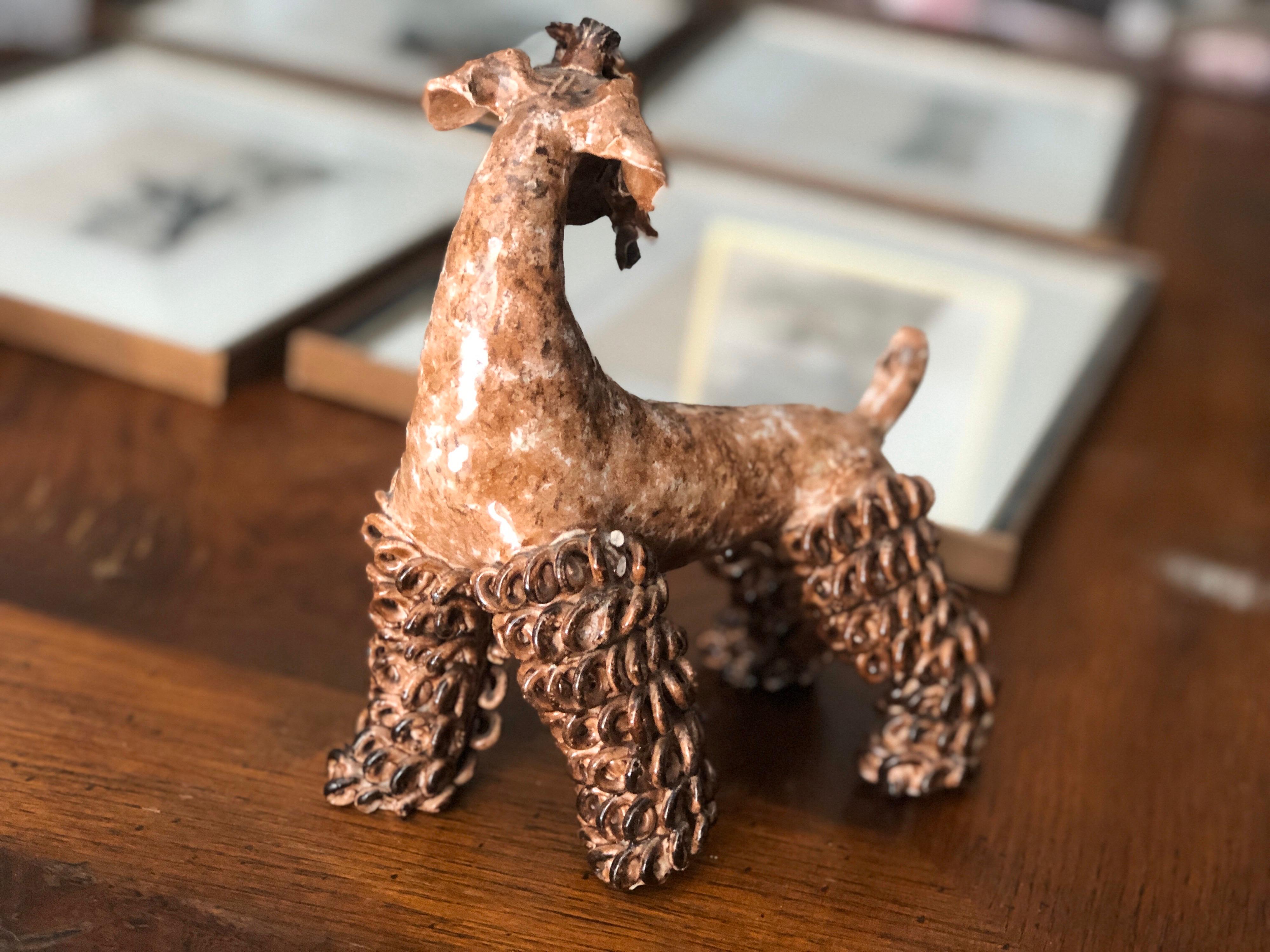 20th century French ceramic sculpture of Zwergschnauzer made by Prunet.
Very vivid and elegant posture in light brown color.
France, circa 1960.