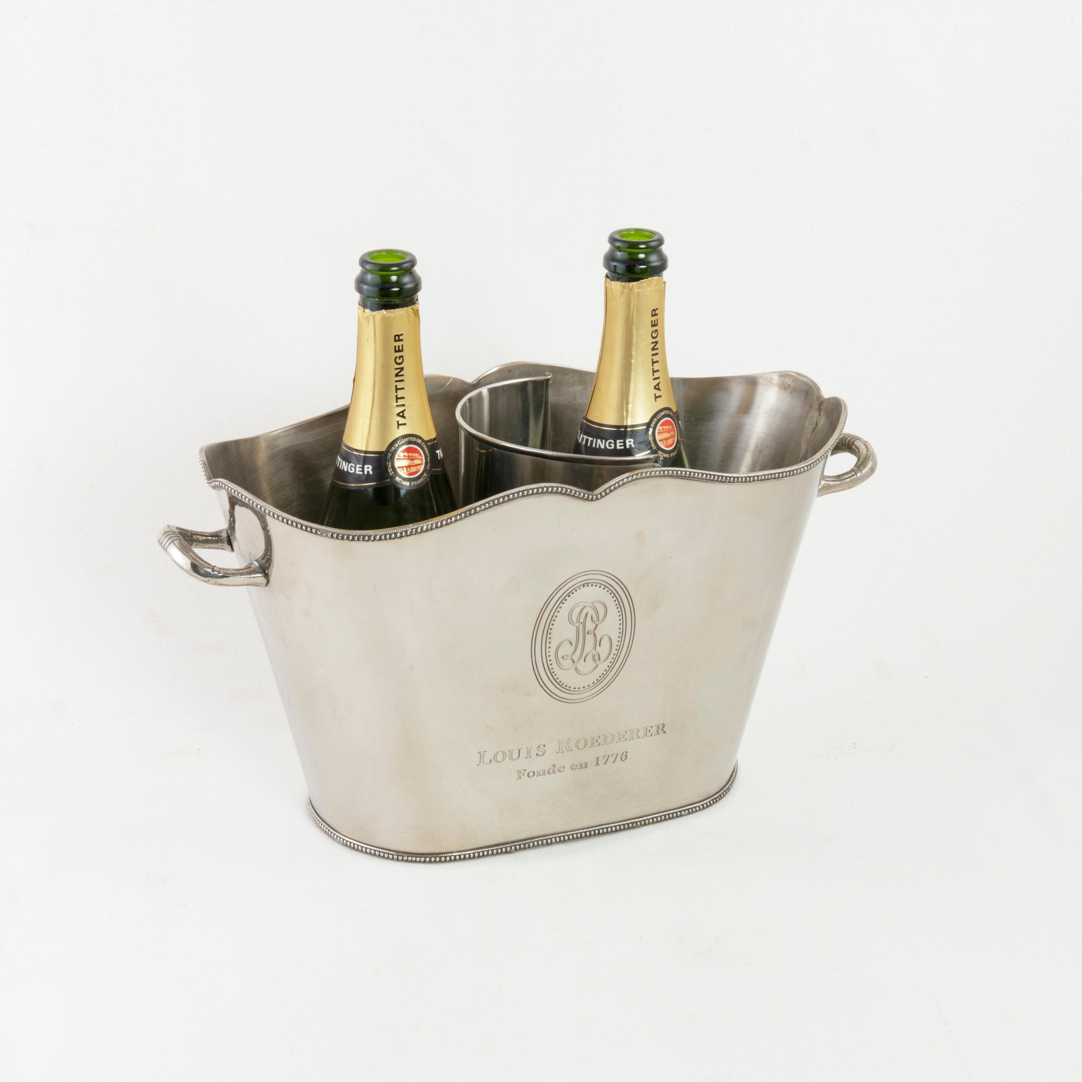 This unique French silver plate champagne bucket from the mid-20th century is marked Louis Roederer, Fonde en 1776, the name of the renowned champagne producer and the year of its establishment. With its unusual oval form detailed with beading