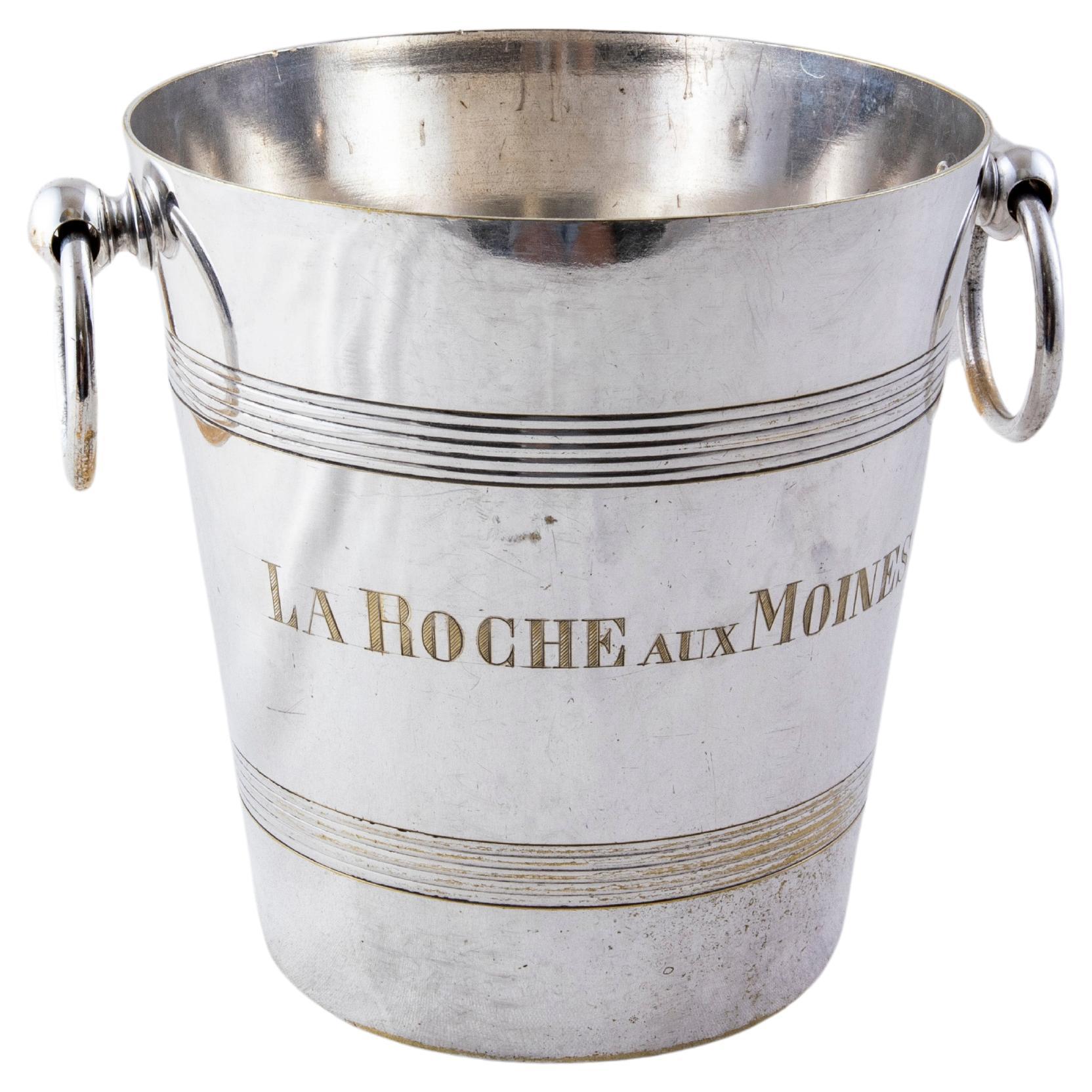 This mid-twentieth century French silver plate wine chiller or champagne bucket is engraved on one side with the name of the vineyard in the Loire Valley, La Roche aux Moines. The other side is engraved 1er Cru d'Anjou indicating the classification