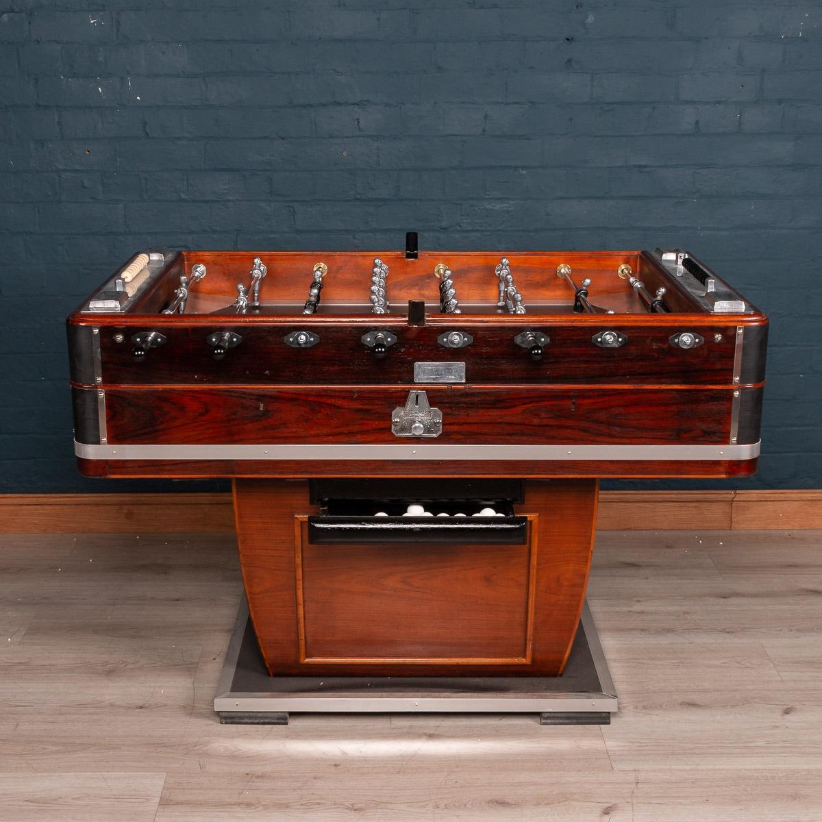 Beautiful and fully restored French table football game, mid-20th century. Painted and varnished wood and chromium plated and other metals, each side with four wooden-handled rods, and mounted with metal ashtrays, the footballers of painted white