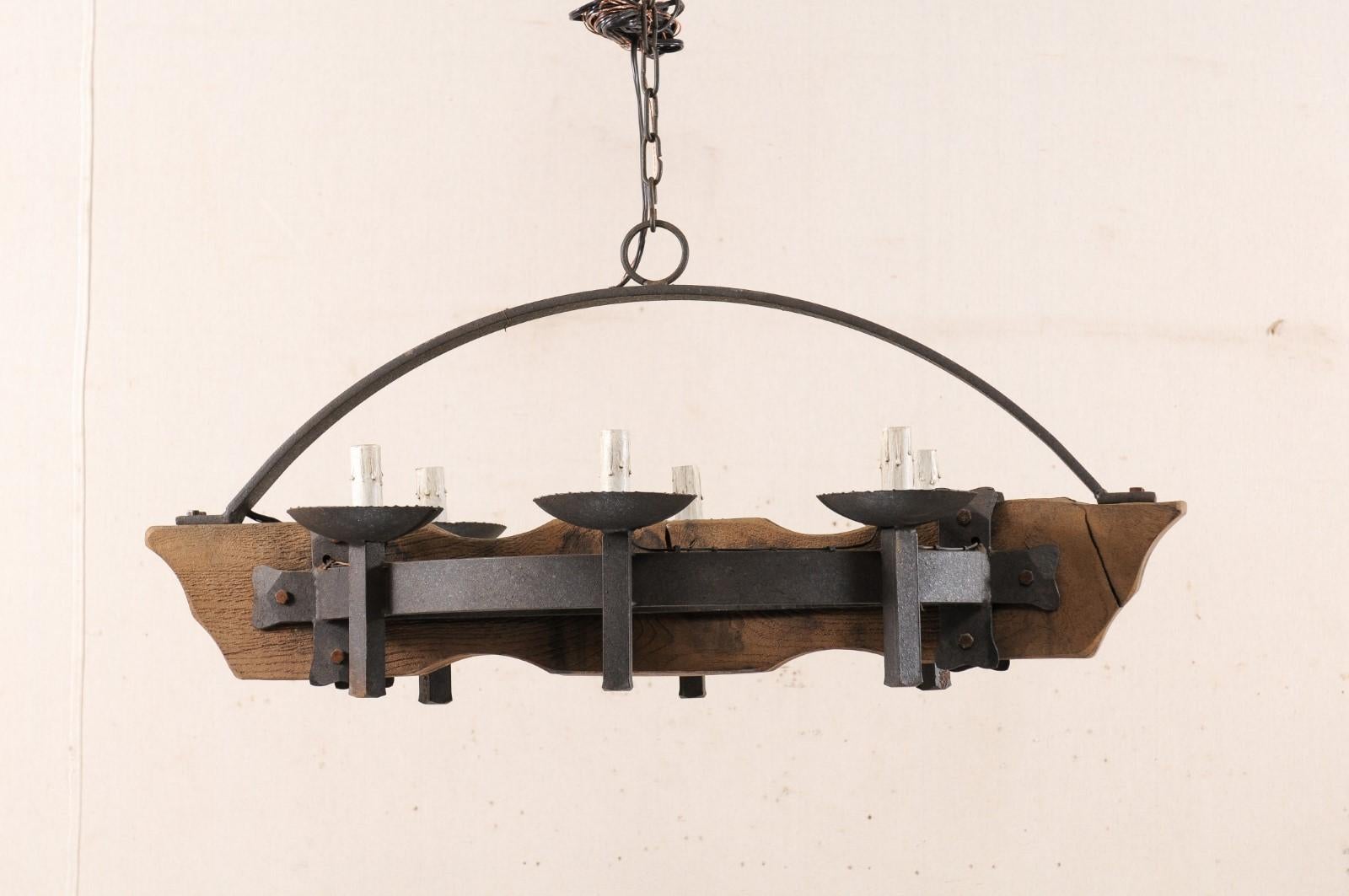 Hammered Mid-20th Century French Wood and Iron Chandelier For Sale