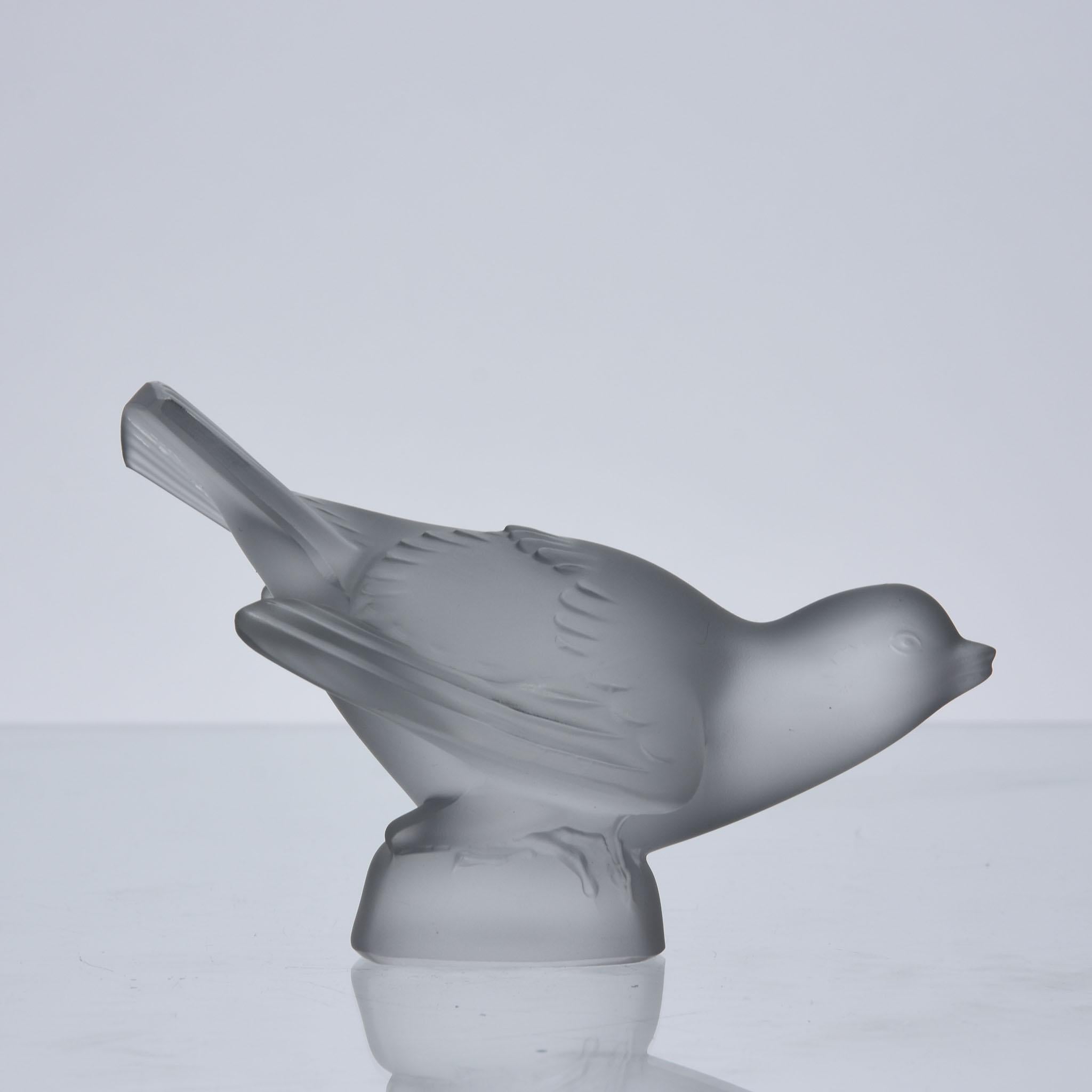 A very sweet clear and frosted glass study of a soaring sparrow, its head and tail raised, the surface with excellent hand finished detail, signed Lalique France

ADDITIONAL INFORMATION
Height: 8.5 cm

Width: 13 cm

Condition: Excellent