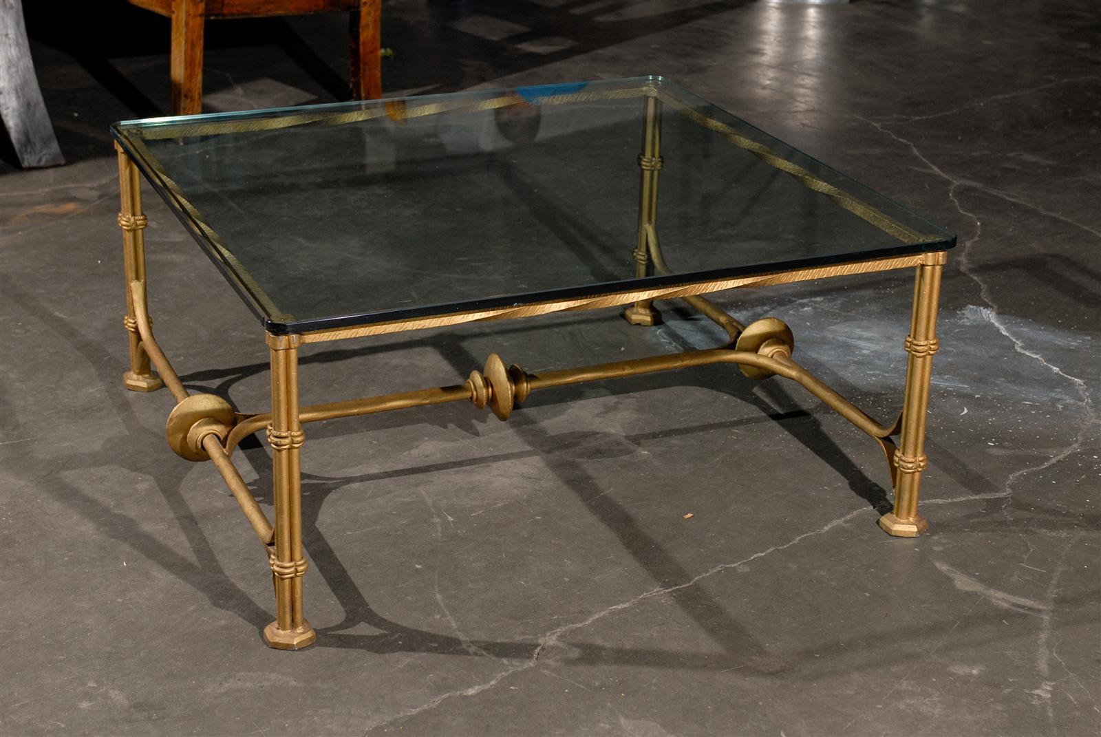 Mid-20th century gilt metal coffee table with glass top.