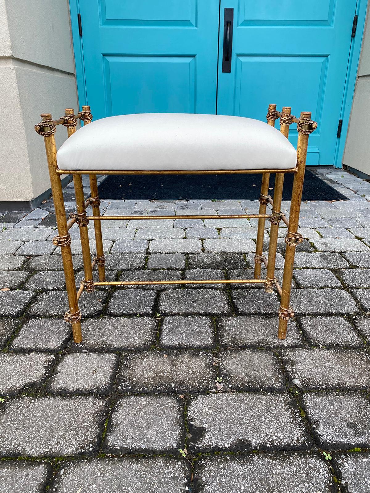 Mid-20th century gilt metal faux bamboo bench or stool. Recovered in muslin.