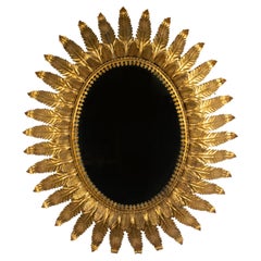 Mitte des 20. Jahrhunderts Vergoldetes Metall Blatt Oval Sunburst Spiegel