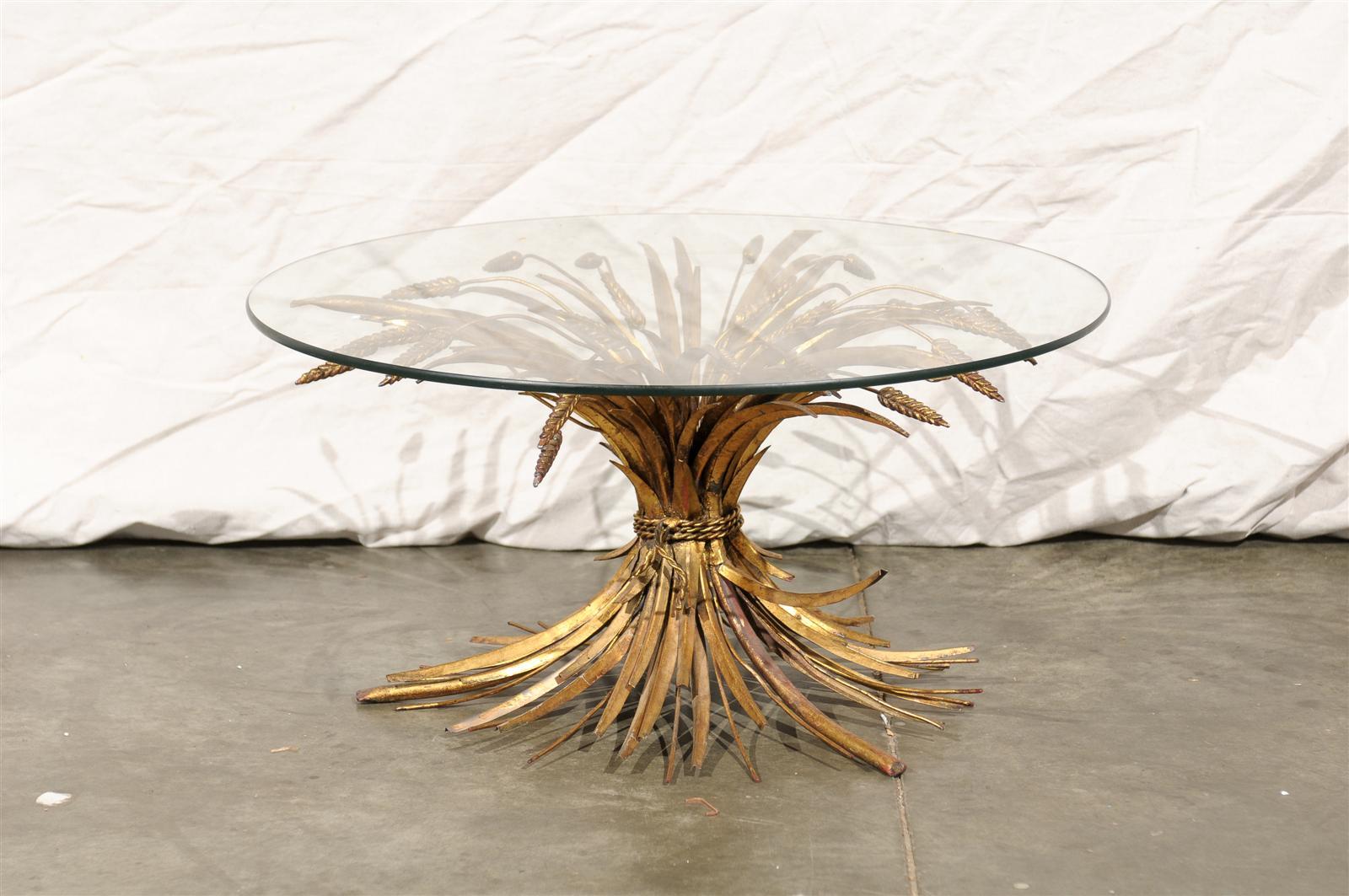 Mid-20th century gilt metal sheaf of wheat coffee table with round glass top.