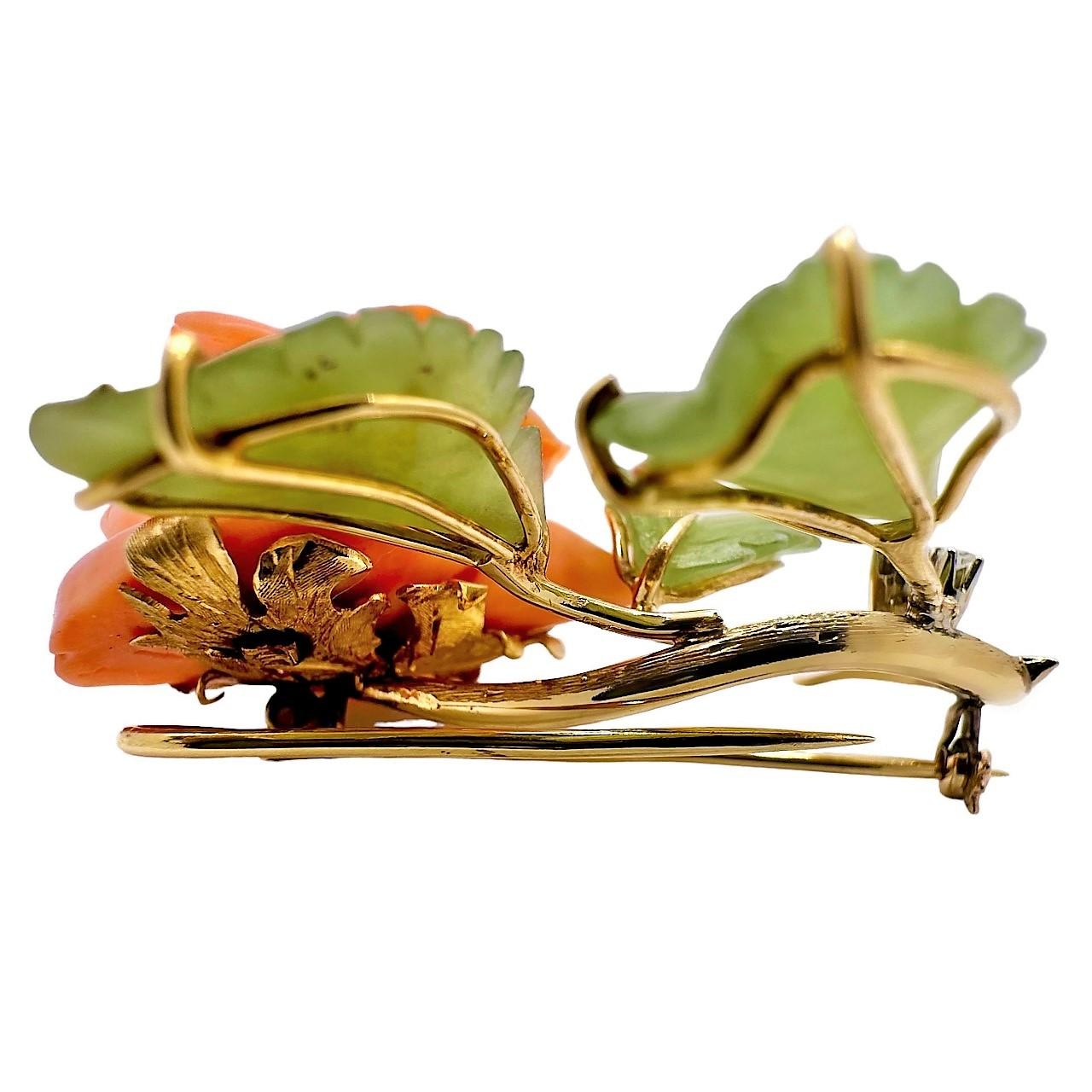 This beautifully executed and sentimental rose brooch has, as it's focal point, an intricately and life like Angel Skin Coral rose. The flower measures 1 1/4 inches by `1 1/4 inches and is cradled by three delicately carved Jade leaves. The stem and