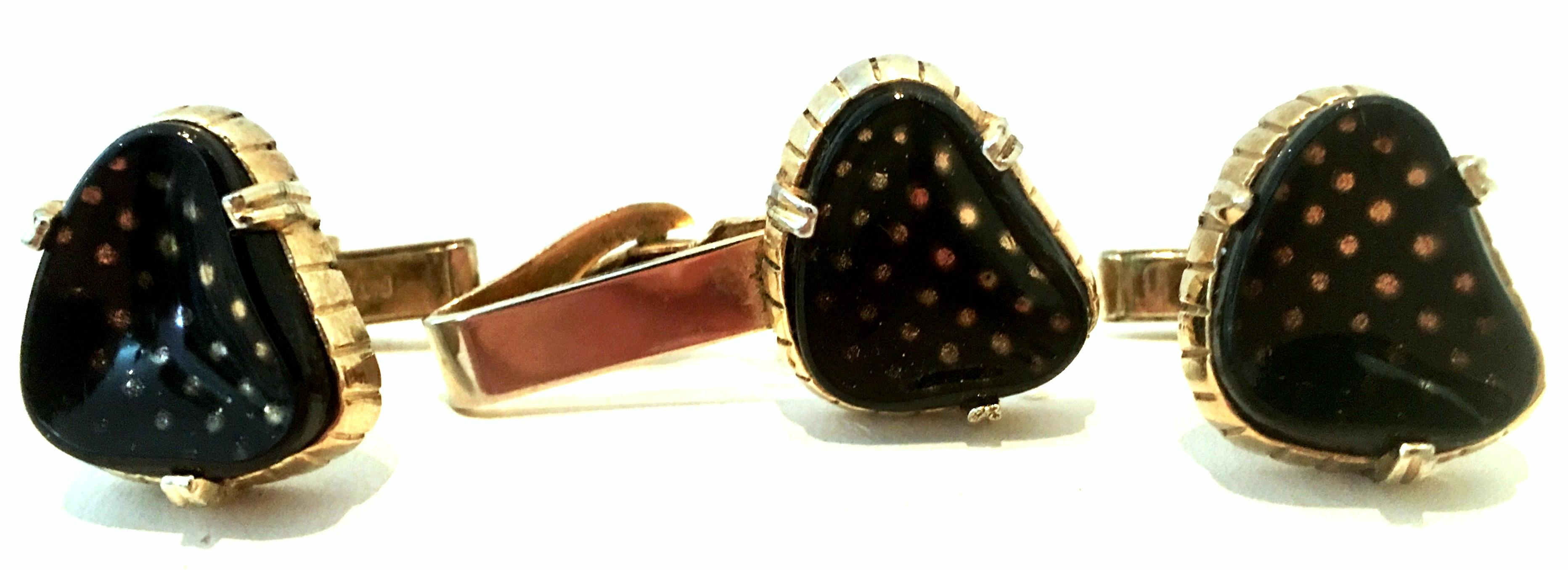Mid-20th Century Gold Plate And Lucite Pair Of Cuff Links & Tie Clip S/3. This finely crafted set of three pieces features gold plate metal with black enamel and 22-k gold dots under cased Lucite. Signed by and engraved patent number
Tie Clip