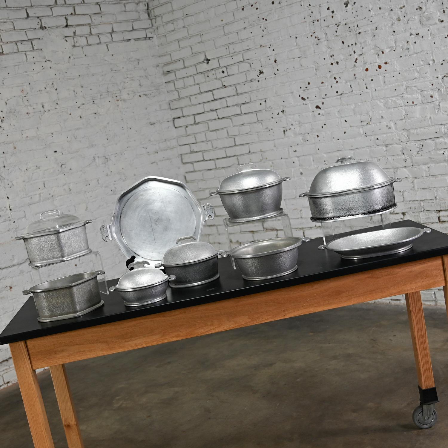 Incredible Mid-20th Century Guardian Service dual purpose 14-piece cookware set including 7 pots, 2 trays, and 5 interchangeable lids. Beautiful condition, keeping in mind that these are vintage and not new so will have signs of use and wear. The