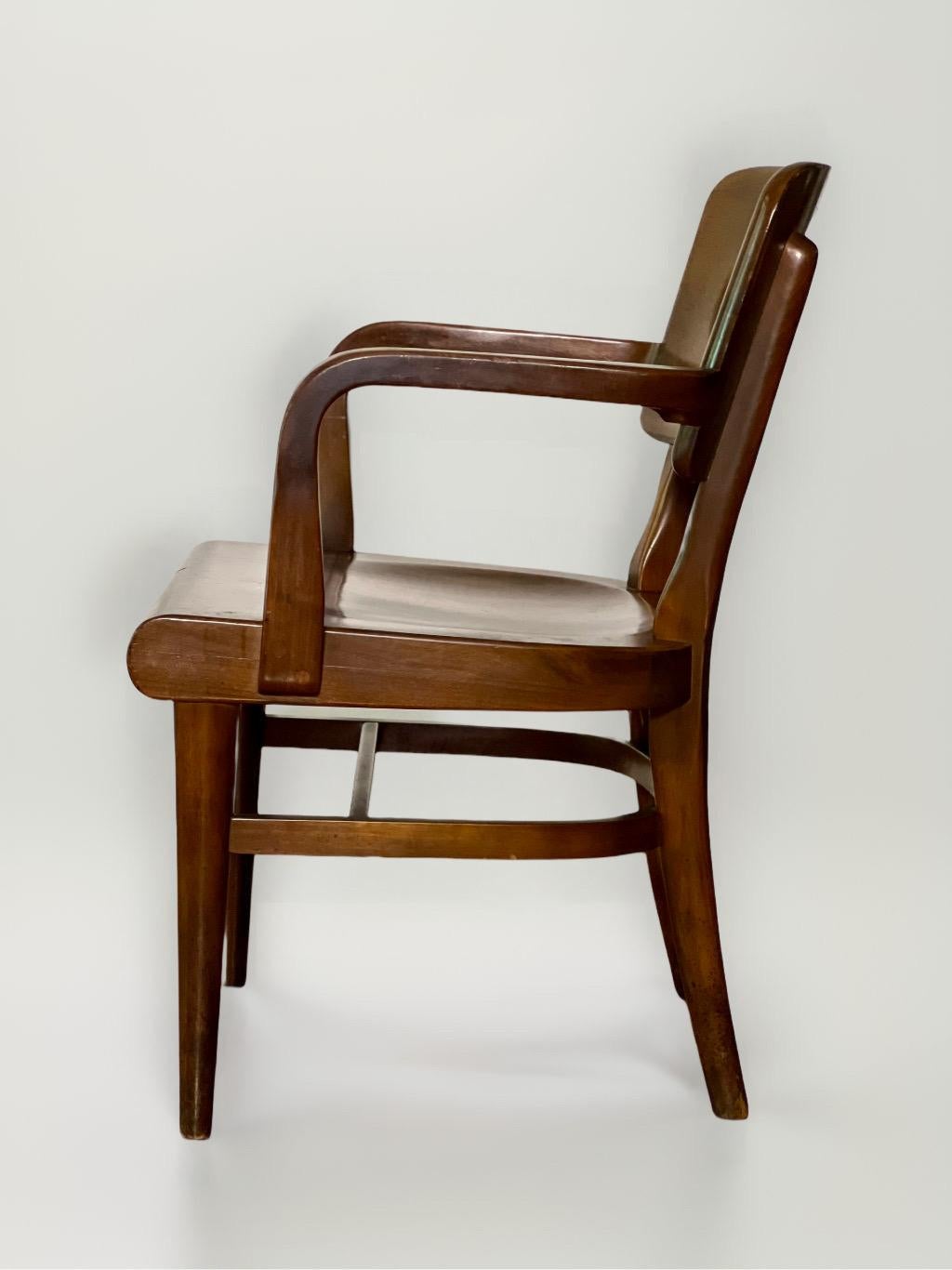 Single vintage 1950s walnut Gunlocke armchair with a molded seat from a Manhattan rectory. Solid and sturdy, a great side chair for an office.
