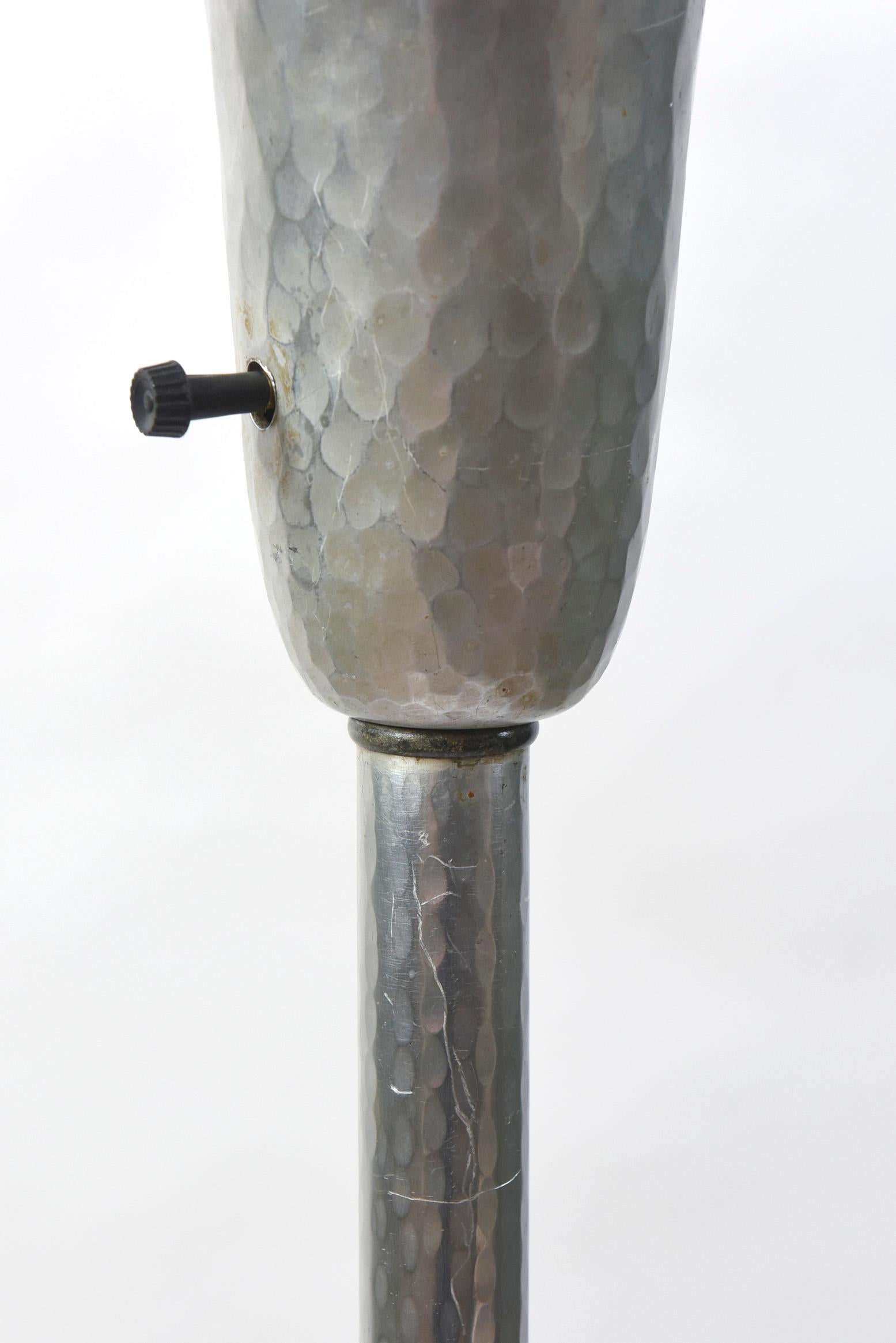 Hammered Aluminum with roses on base. Lovely modern form. Original bent glass shade. C. 1930. Completely rewired and restored.

Dimensions: 
Height: 63
Width (diameter): 18