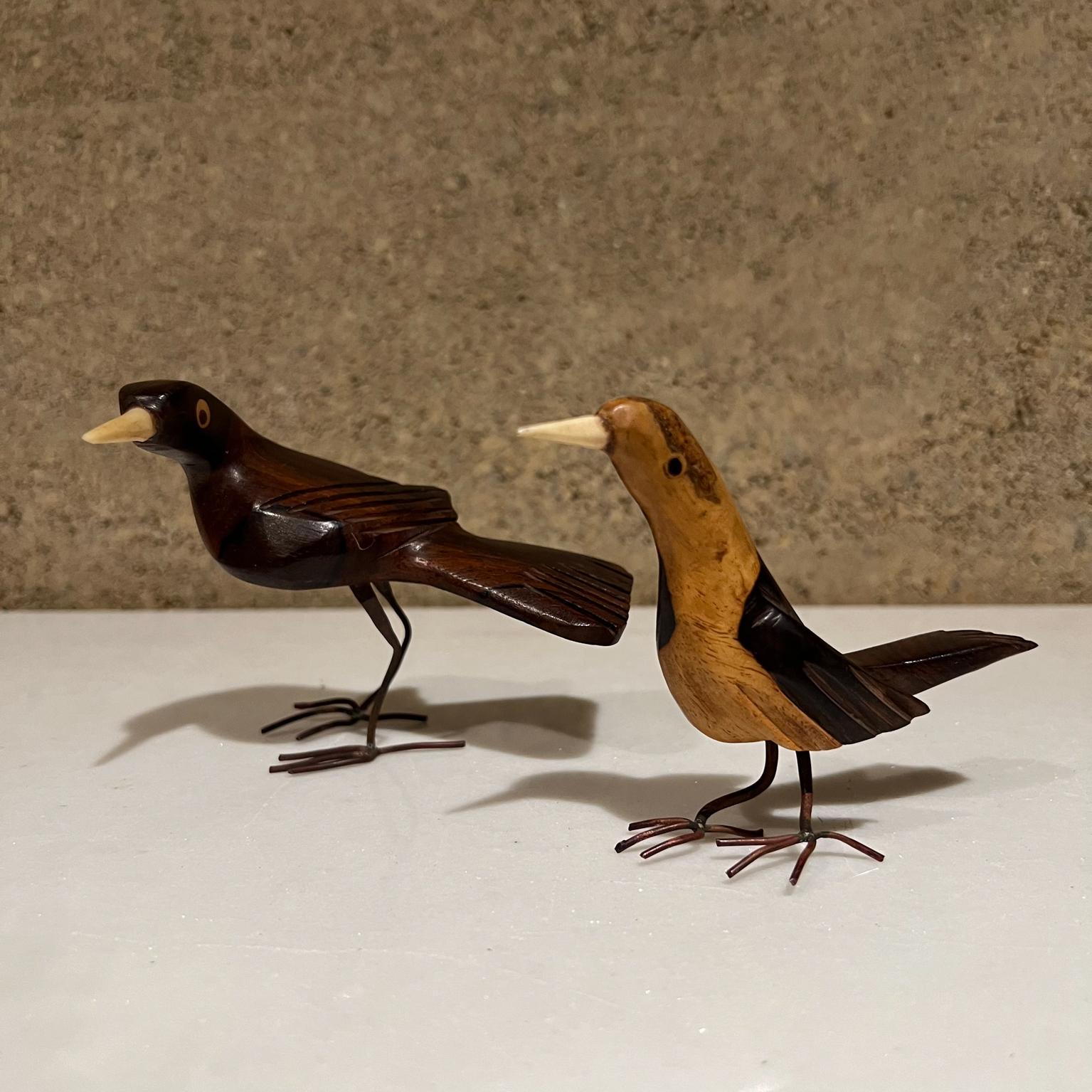 Mid 20th Century carved birds in Palo Fierro Wood Two-tone
3.5 tall x 3w x 4d larger bird
Preowned unrestored vintage condition
See images provided.
 