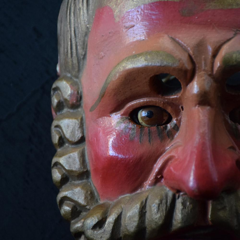 Mid-20th century hand carved Guatemalan mask.

A decorative example of a mid-20th century Guatemalan dance mask of the male form. With painted inserted eyes, red lips, and golden hair.

Size of inches: H 10” x W 7” x D 6”

Completely solid in