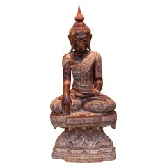 Mid 20th century hand-carved sitting Buddha from Myanmar in teakwood