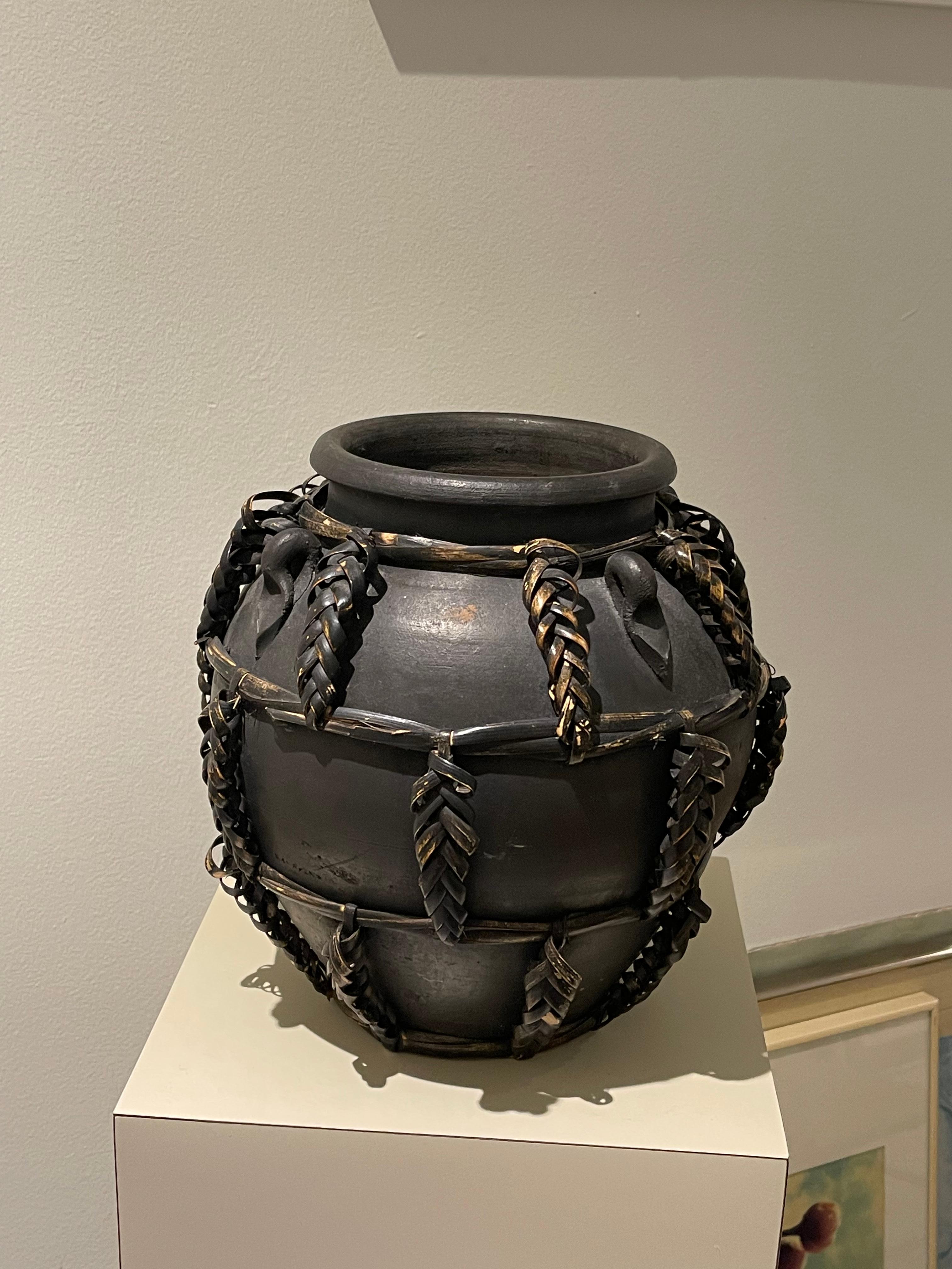 Mid 20th Century Hand Crafted Ceramic Pottery with handwoven and hand painted techniques. This piece is brilliantly painted and constructed with a unique woven design. It was painted black and offers a desirable brutalist style that acts as a great