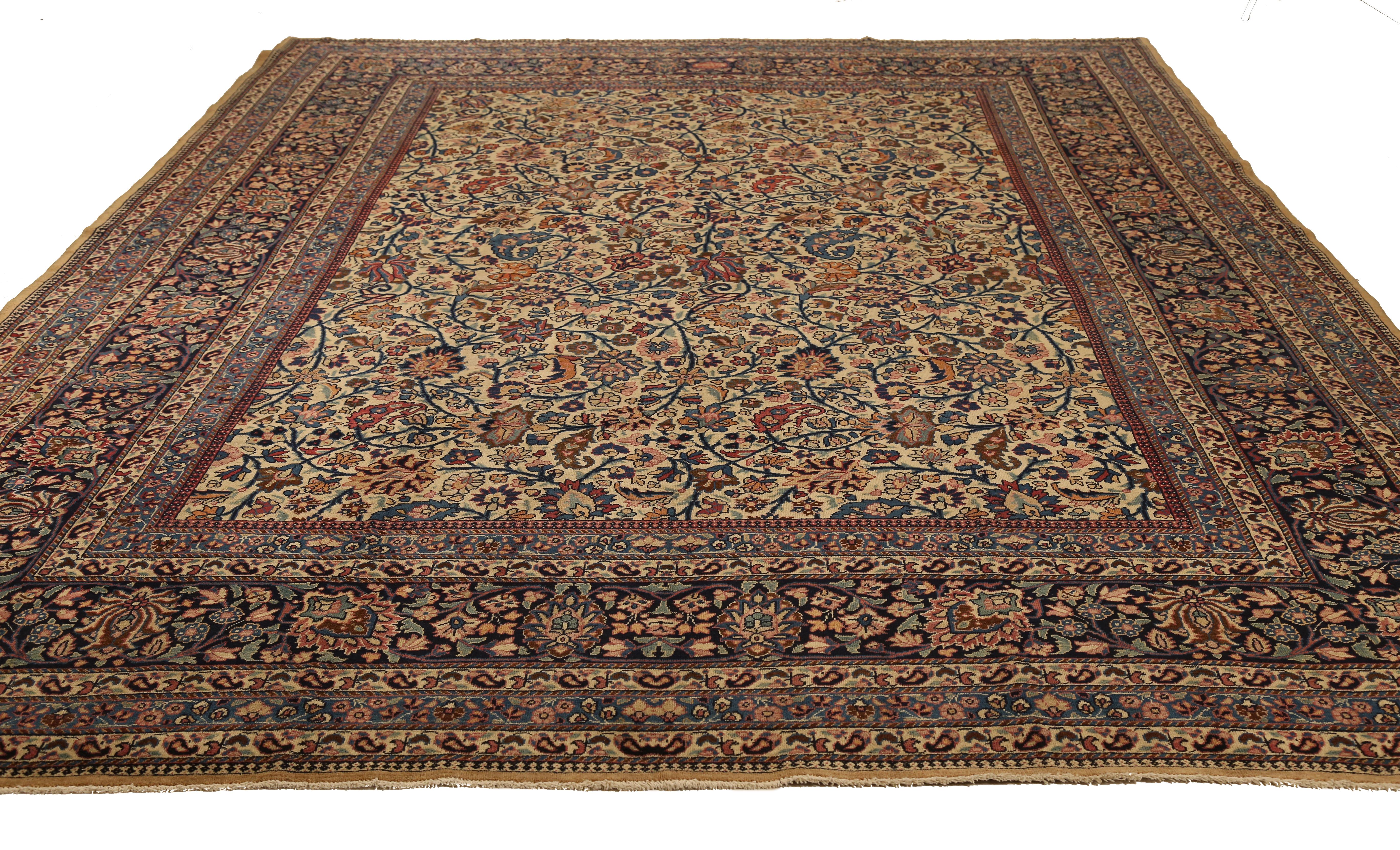 Mid-20th century hand knotted Persian area rug made from fine wool and all-natural vegetable dyes that are safe for people and pets. This beautiful piece features intricate floral patterns in various colors which Mashad rugs are known for. Persian