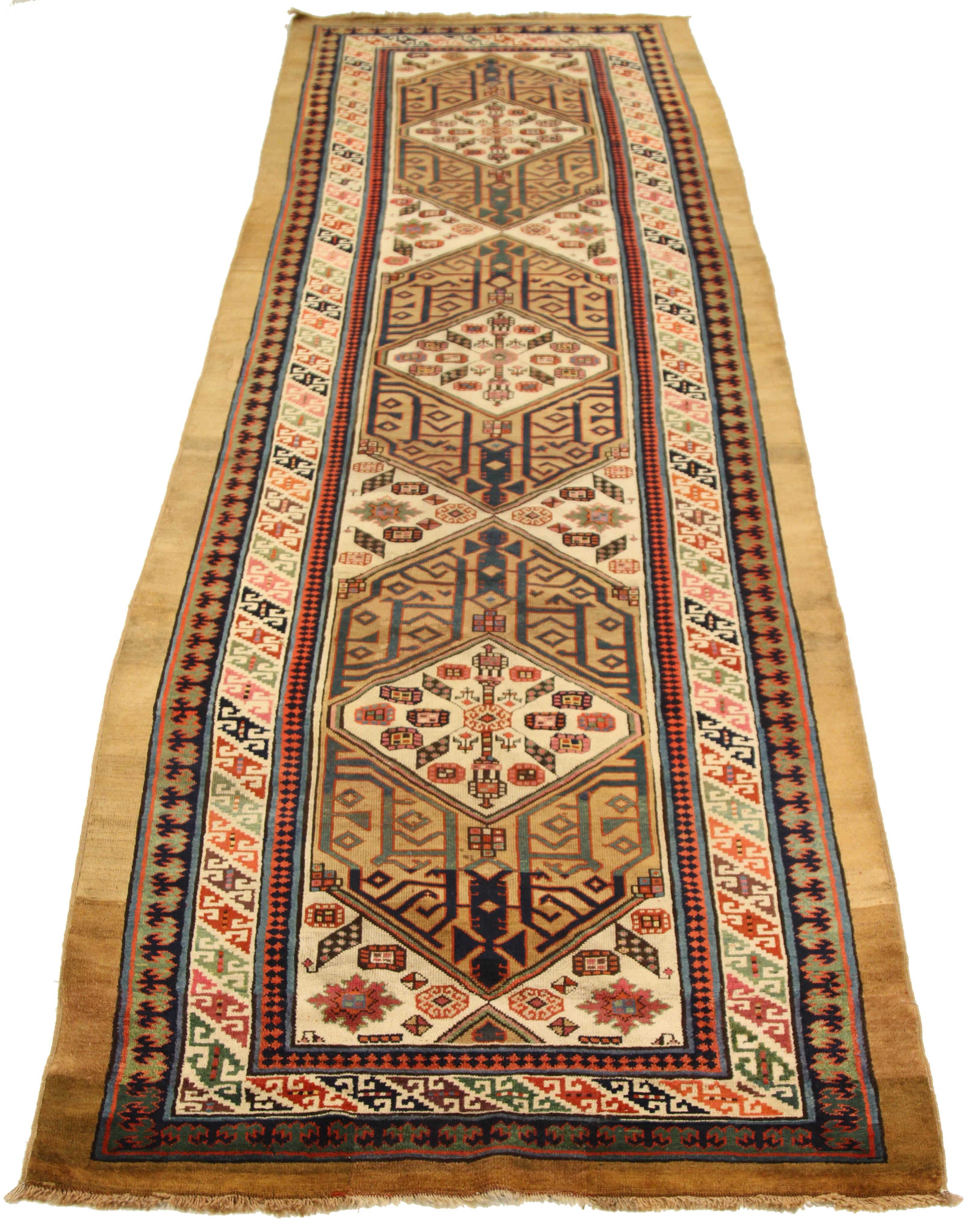 Mid-20th century hand knotted Persian runner rug made from fine wool and all-natural vegetable dyes that are safe for people and pets. This beautiful piece features a blend of geometric and floral details that embody the artistic qualities of the