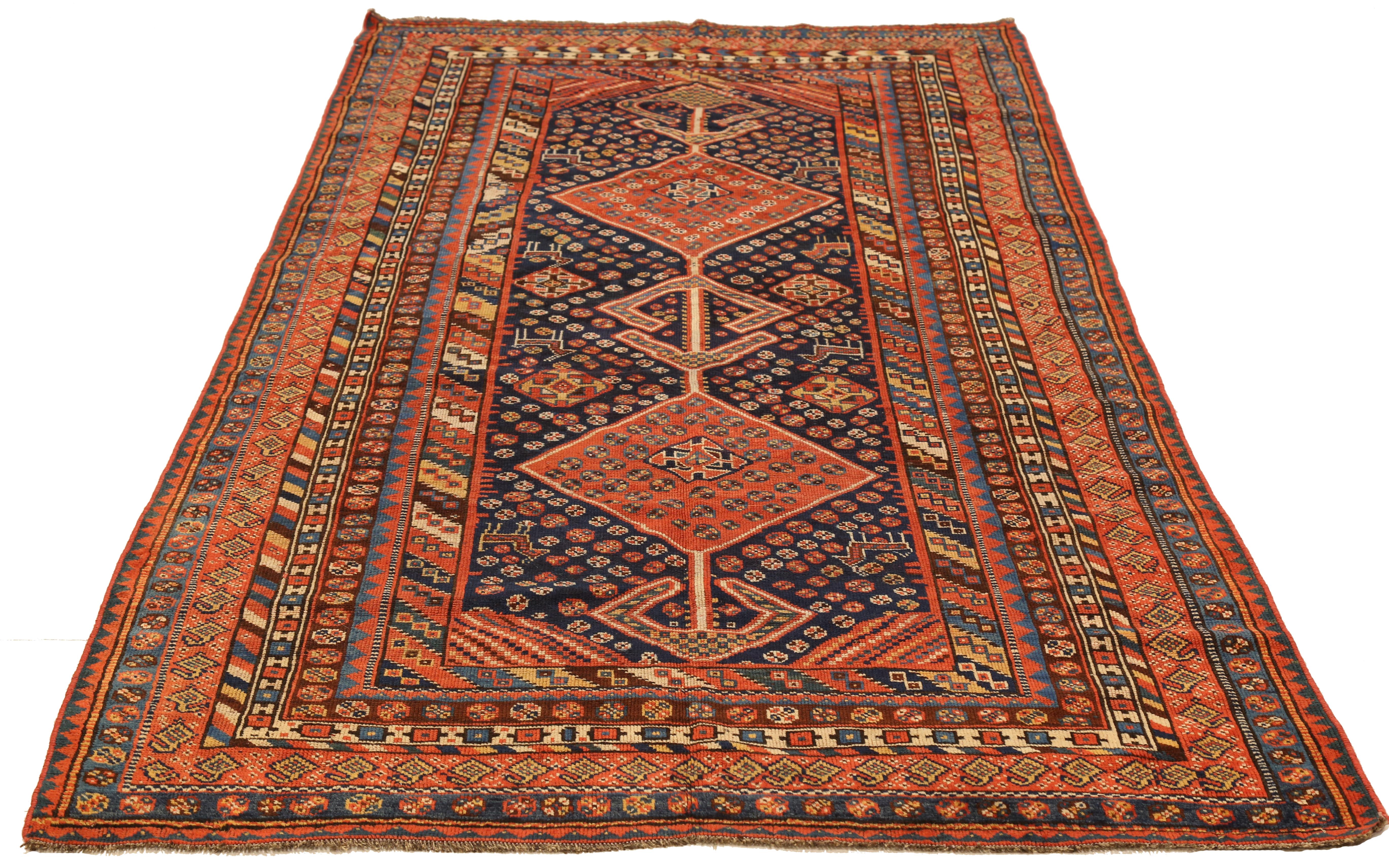Mid-20th century hand knotted Persian area rug made from fine wool and all-natural vegetable dyes that are safe for people and pets. This beautiful piece features intricate tribal details in various colors which Shiraz rugs are known for. Persian