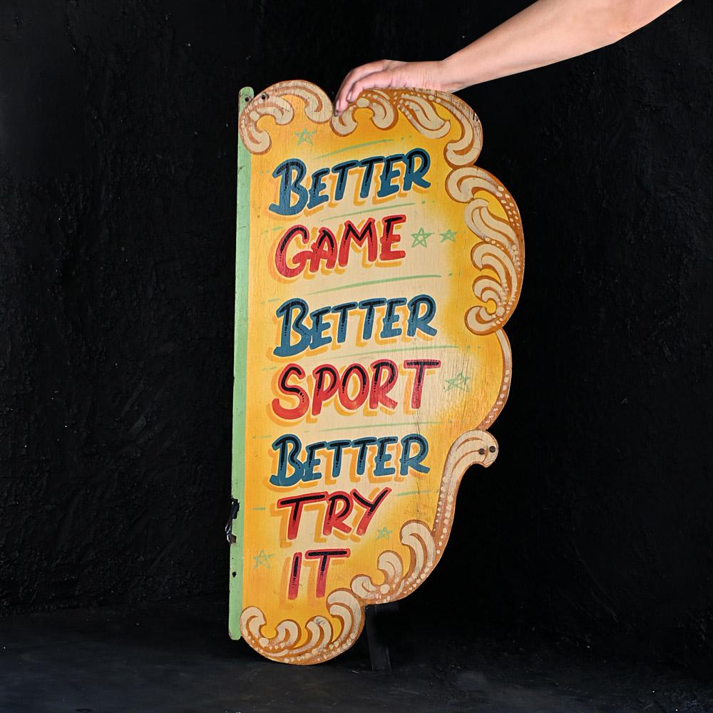 Mid-20th Century Hand Painted Double Sided English Fairground Sign

A genuine English mid-20th Century double sided hand painted fairground sign. Better Game, Better Sport, Better Try It. Written on both sides of this sign, It would have been