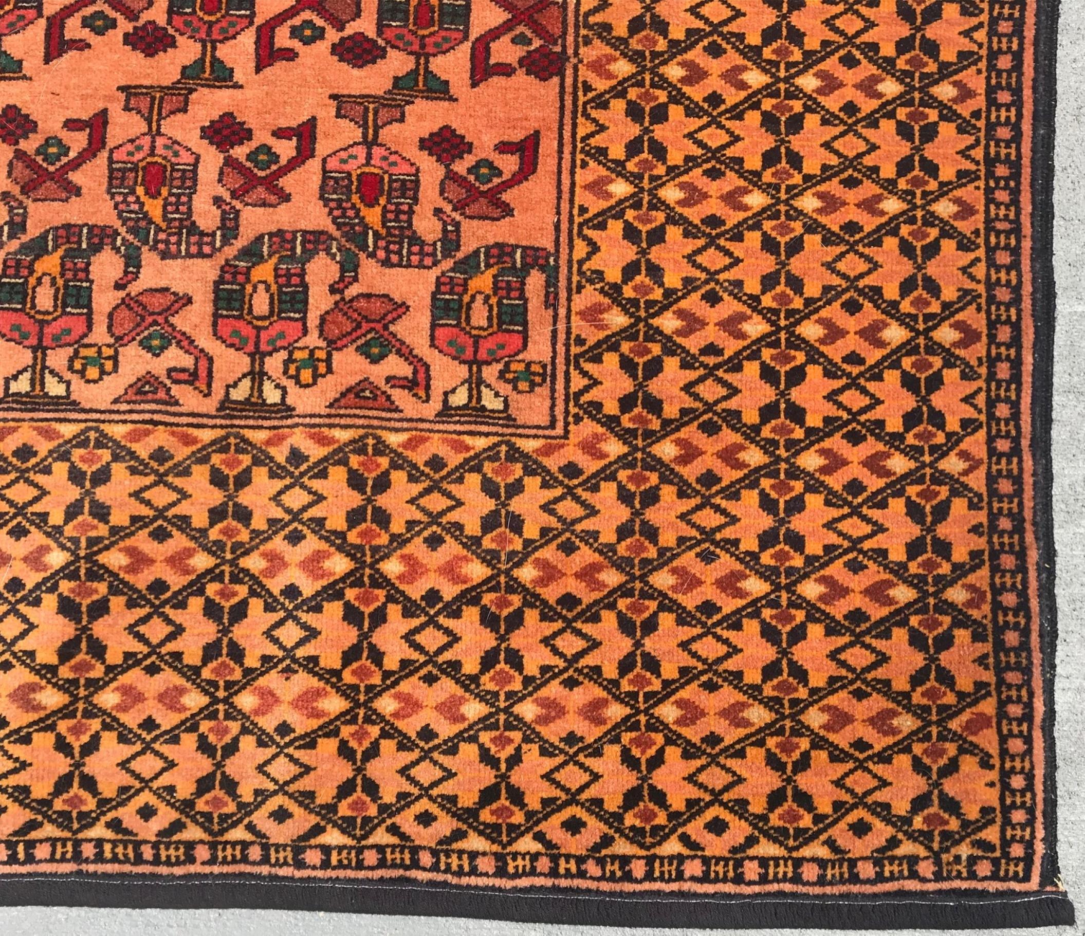 Mid 20th century hand woven Persian Bashir rug.

The circa 1950 Persian Bashir Zili Sultan Rug is hand woven with silk warp. It is very finely and distinctly woven with in a quiet Boteh motif pattern. The allover color is rich coral.