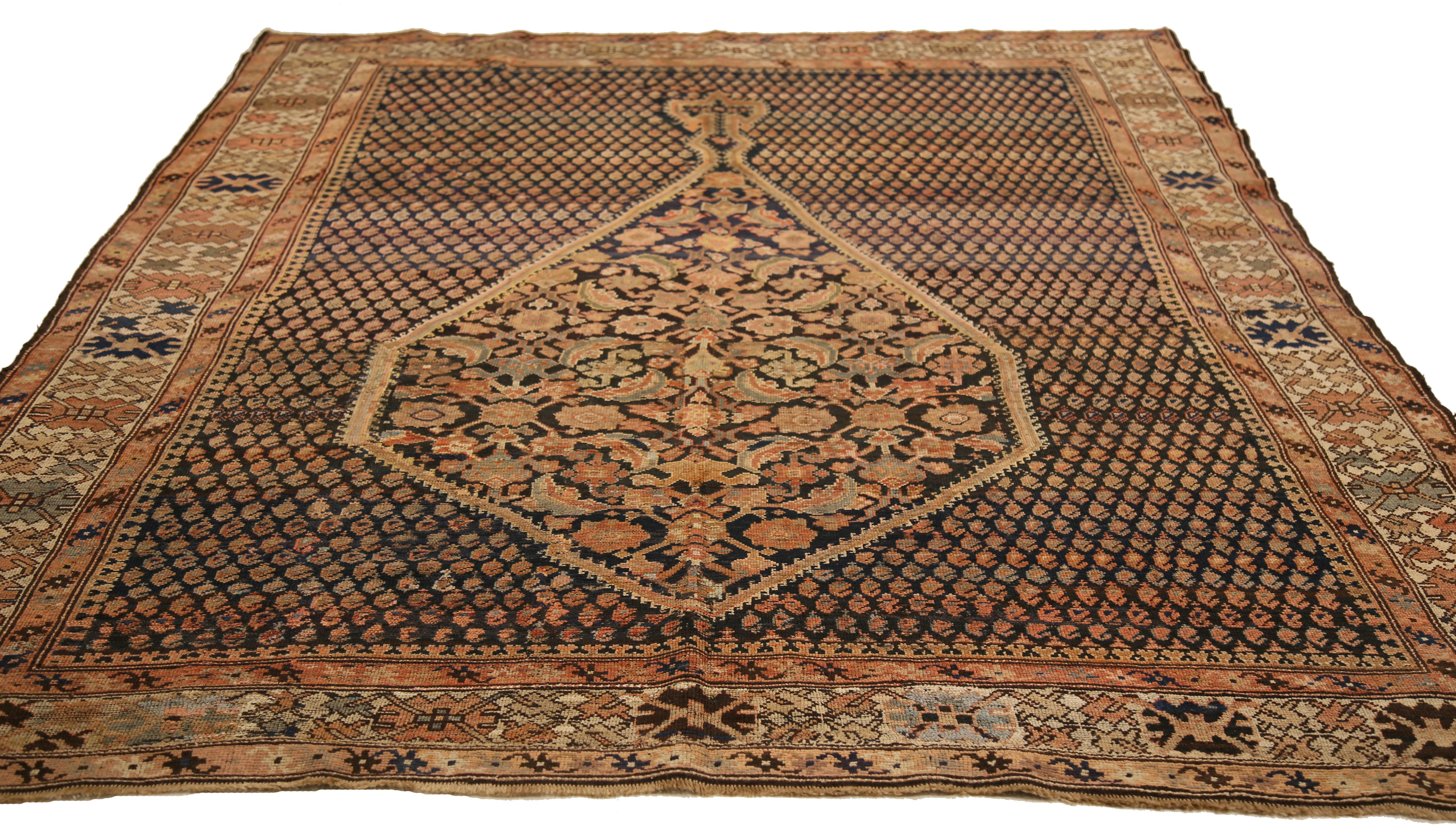 Mid-20th century hand-woven Persian area rug made from fine wool and all-natural vegetable dyes that are safe for people and pets. It features traditional Malayer weaving depicting elaborate 'Boteh' patterns that represents life and eternity in