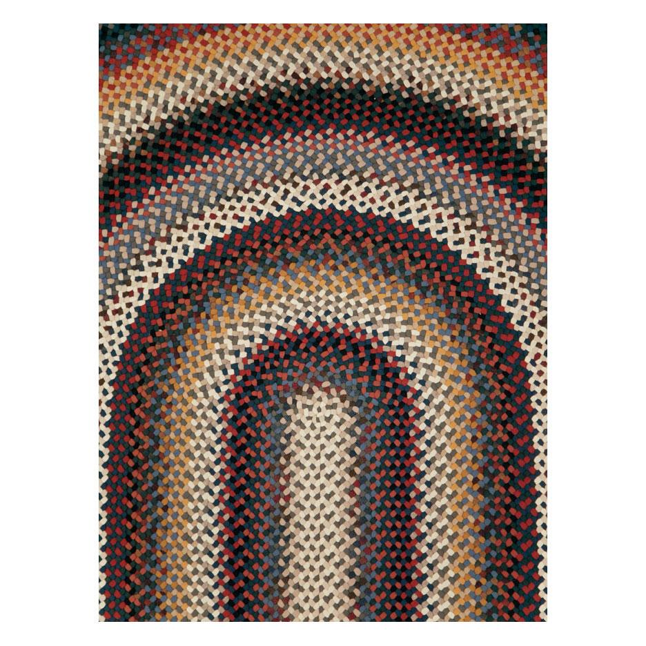 A vintage American Braided large oval carpet handmade during the mid-20th century.

Measures: 12' 2