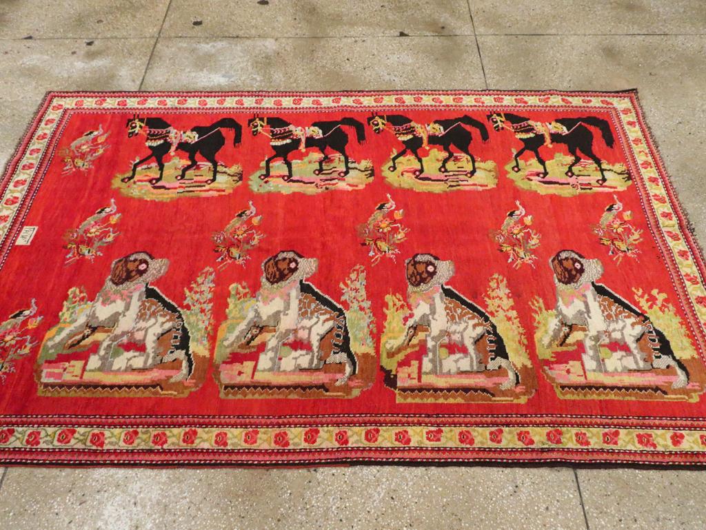 This striking mid-20th-century Caucasian Karabagh pictorial rug, measuring 4' 11