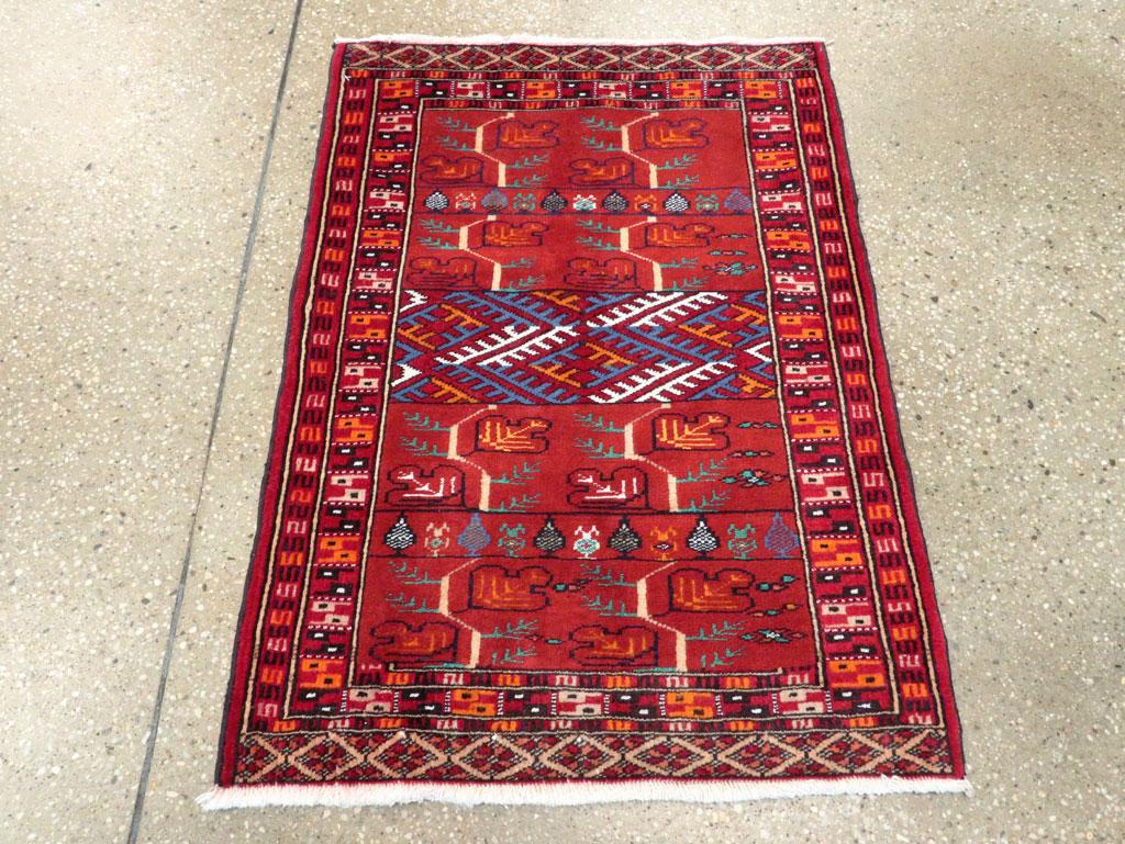 A vintage Central Asian Turkoman small throw rug handmade during the mid-20th century.

Measures: 2' 0