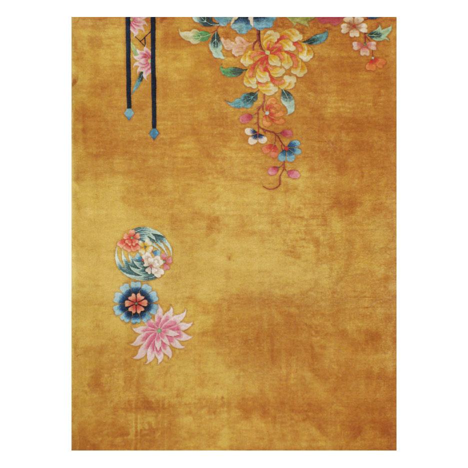 A vintage Chinese Art Deco large room size rug handmade during the mid-20th century with colorful floral bouquets on each corner over a solid background in shades of goldenrod and mustard.

Measures: 11' 1