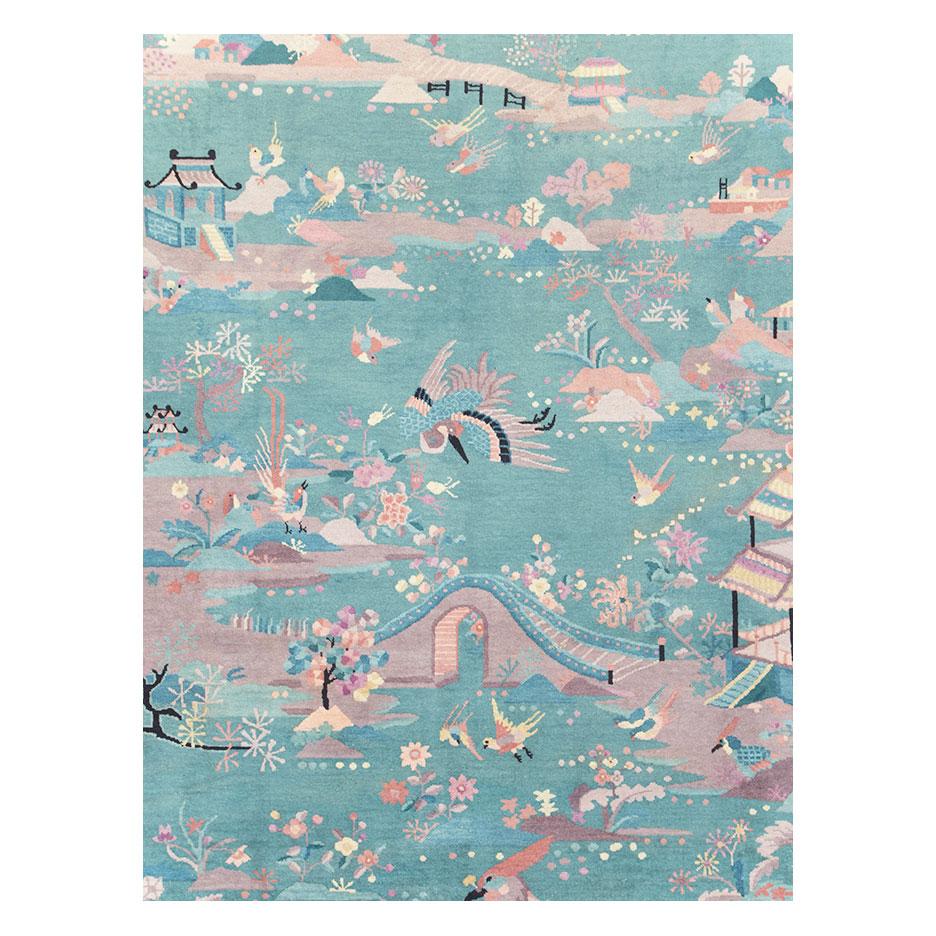 A vintage Chinese Art Deco room size carpet handmade during the mid-20th century with a pictorial design in a pale mauve tone over a seafoam green background.

Measures: 12' 5