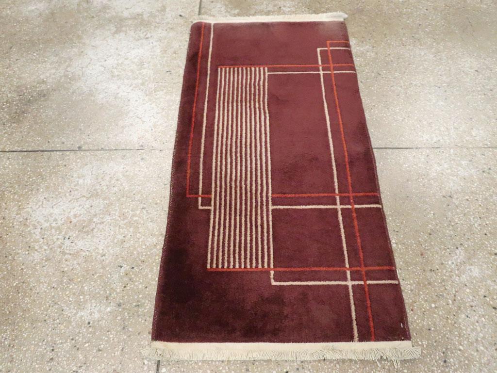 A vintage Chinese Art Deco throw rug handmade during the mid-20th century.

Measures: 2' 0