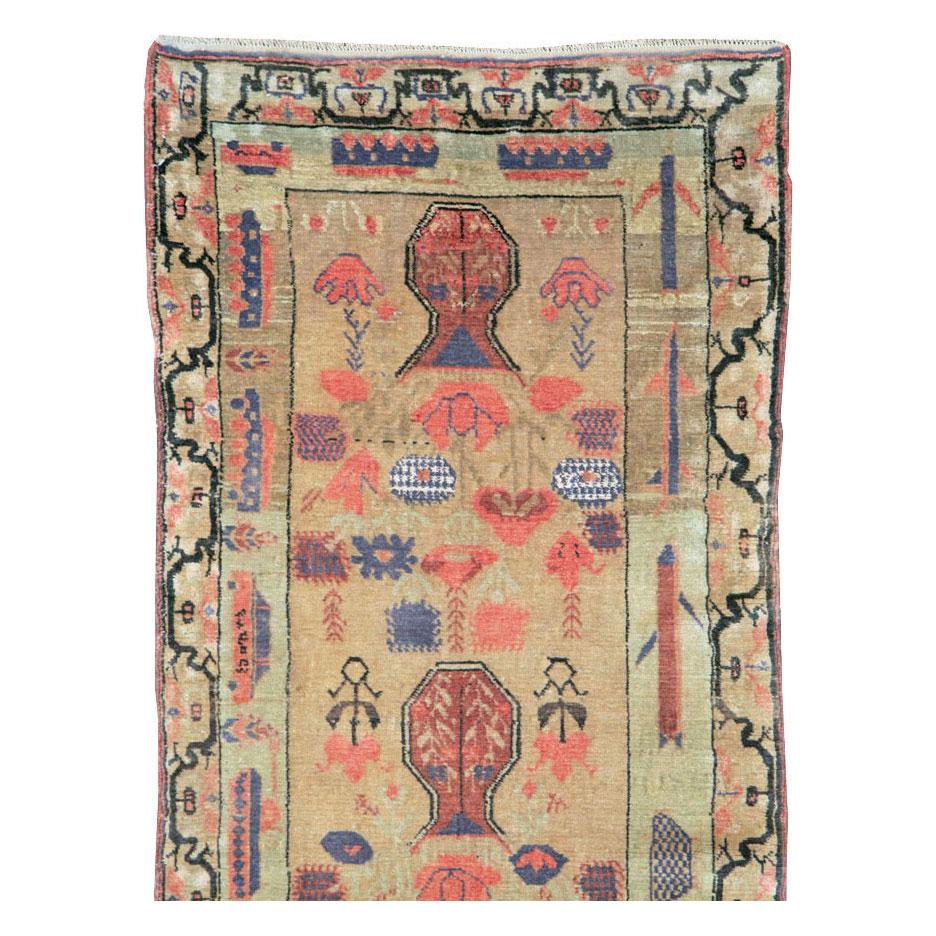 A vintage East Turkestan Khotan rug in runner format handmade during the mid-20th century.

Measures: 2' 6