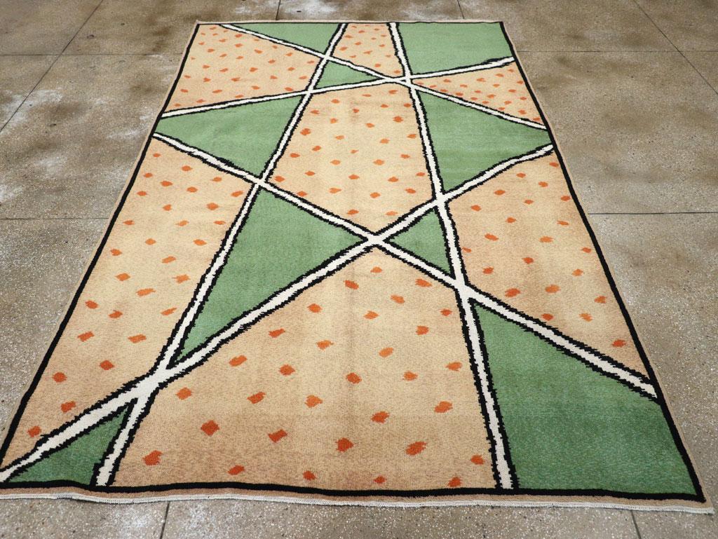 A vintage French Art Deco room size carpet handmade during the mid-20th century.

Measures: 7' 7