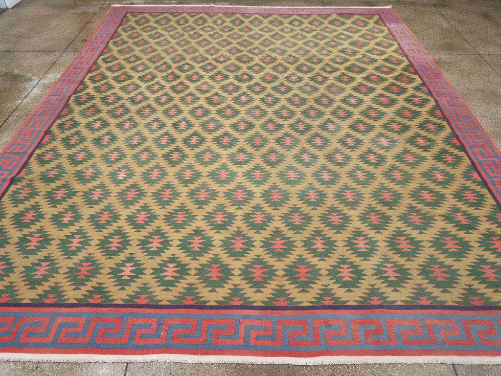 A vintage Indian flatweave Dhurrie large room size carpet handmade during the mid-20th century.

Measures: 12' 0